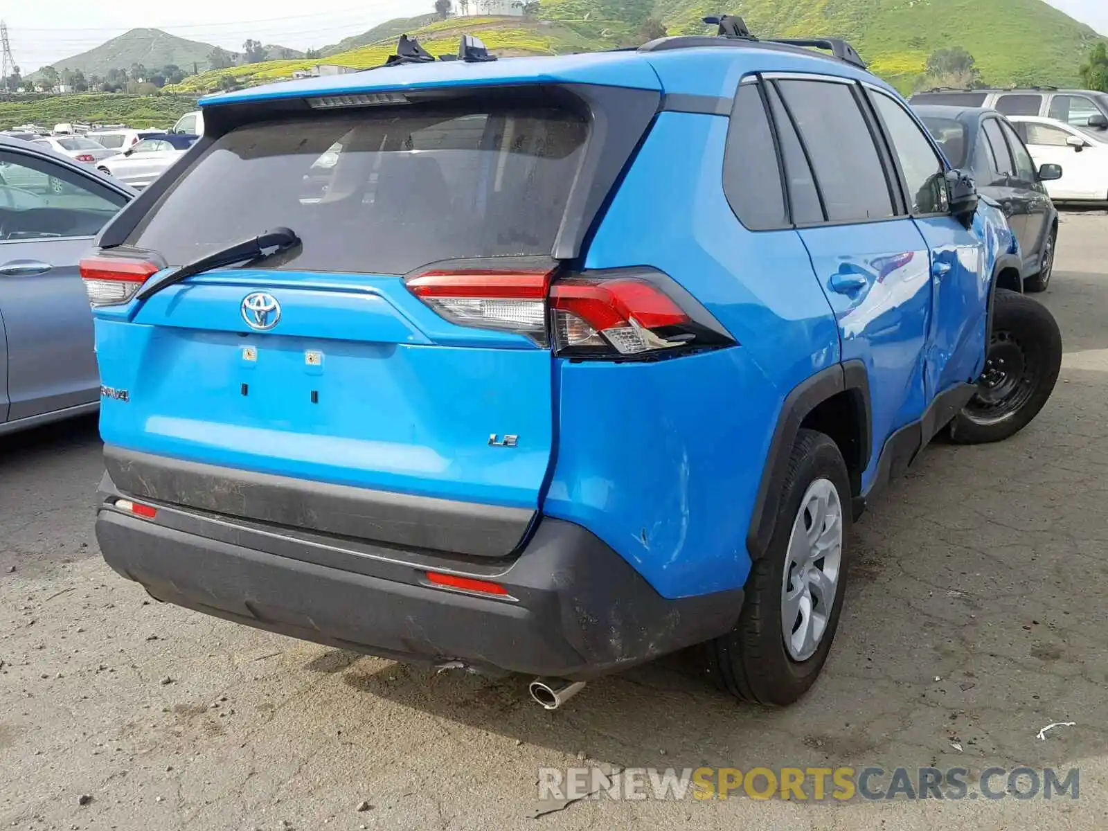 4 Photograph of a damaged car JTMH1RFV2KJ004412 TOYOTA RAV4 LE 2019