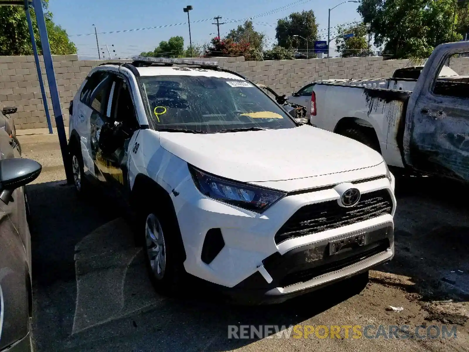 1 Photograph of a damaged car JTMH1RFV9KD502234 TOYOTA RAV4 LE 2019