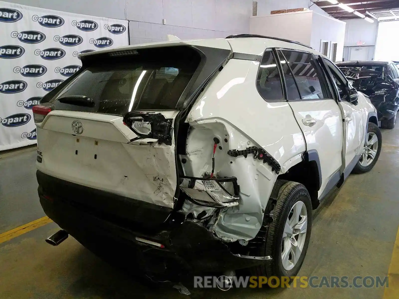 4 Photograph of a damaged car JTMW1RFV0KD019383 TOYOTA RAV4 XLE 2019