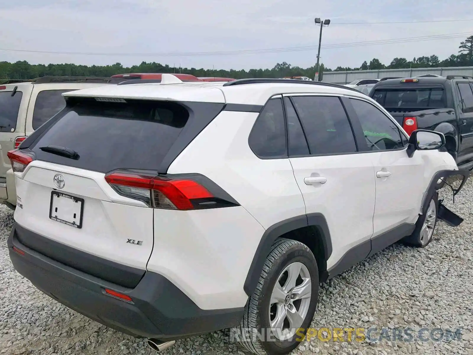 4 Photograph of a damaged car JTMW1RFV2KD009776 TOYOTA RAV4 XLE 2019