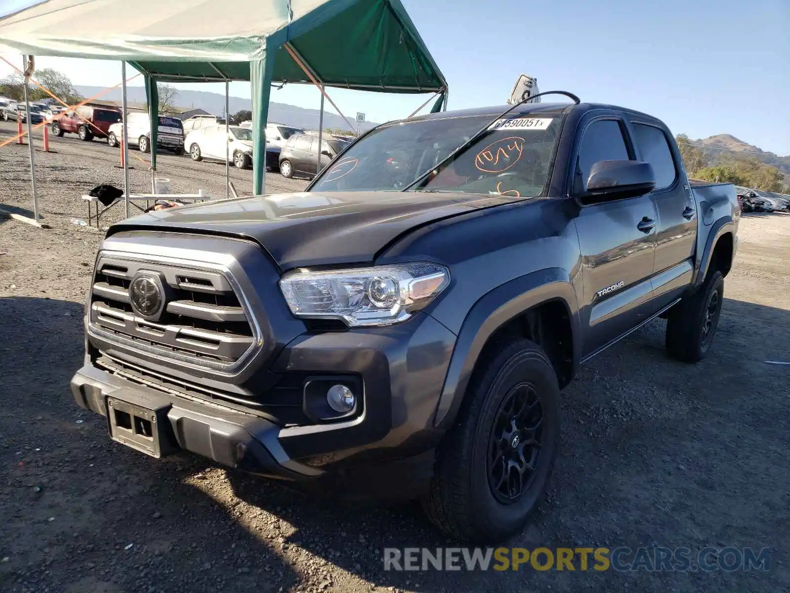 2 Photograph of a damaged car 3TMAZ5CN0KM102087 TOYOTA TACOMA 2019