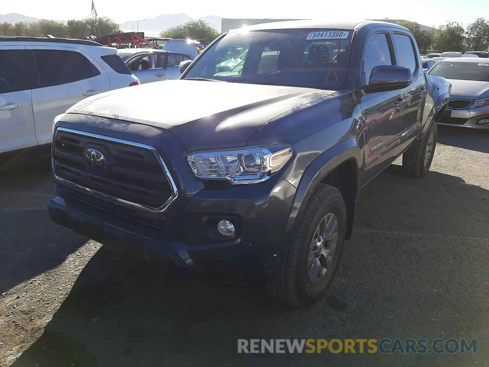 2 Photograph of a damaged car 3TMAZ5CN0KM103904 TOYOTA TACOMA 2019