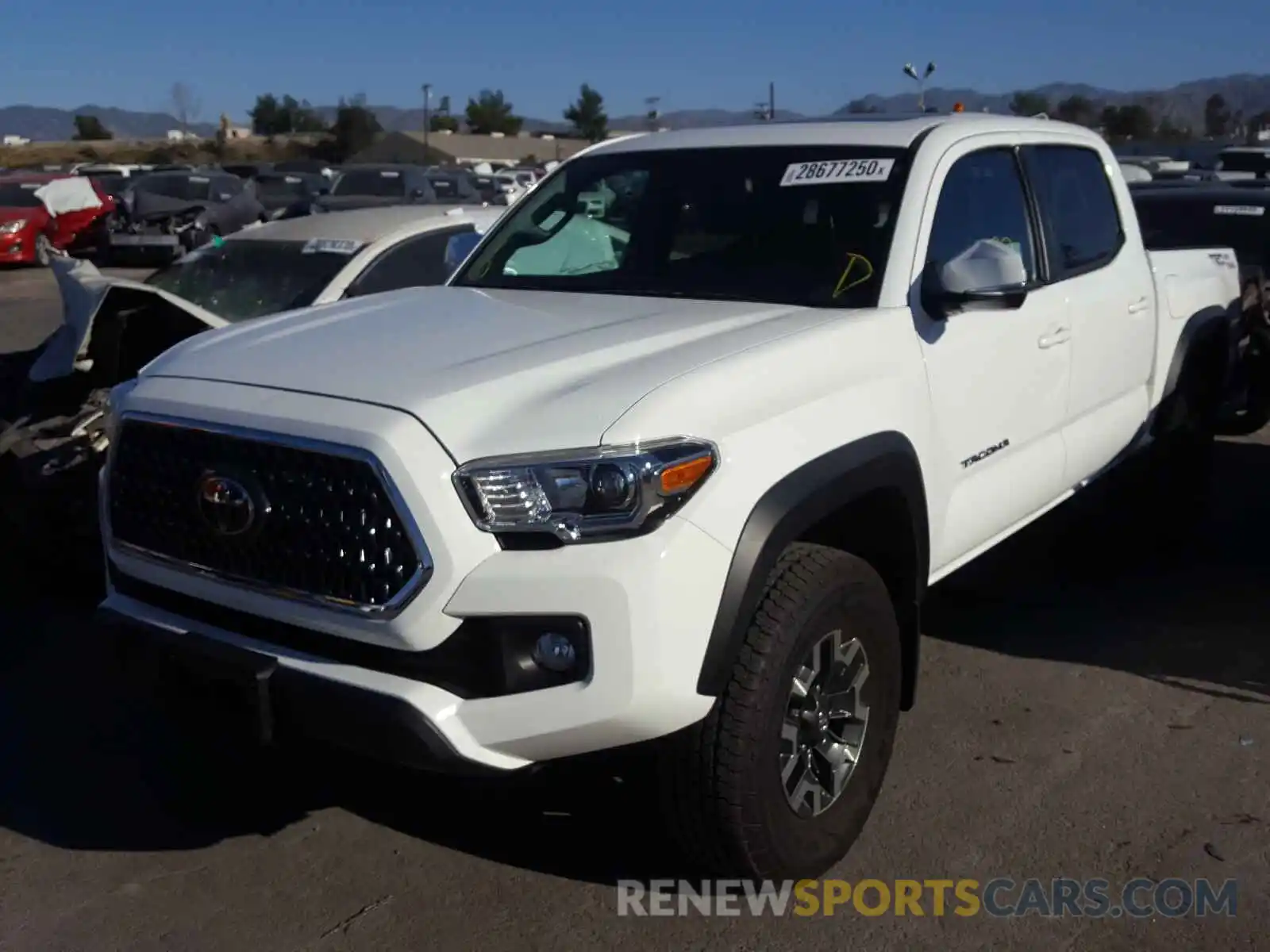 2 Photograph of a damaged car 3TMAZ5CN0KM104020 TOYOTA TACOMA 2019