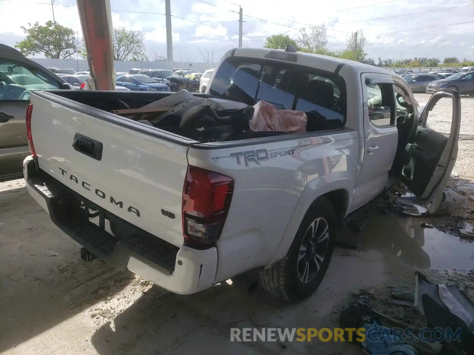 4 Photograph of a damaged car 3TMAZ5CN1KM110909 TOYOTA TACOMA 2019