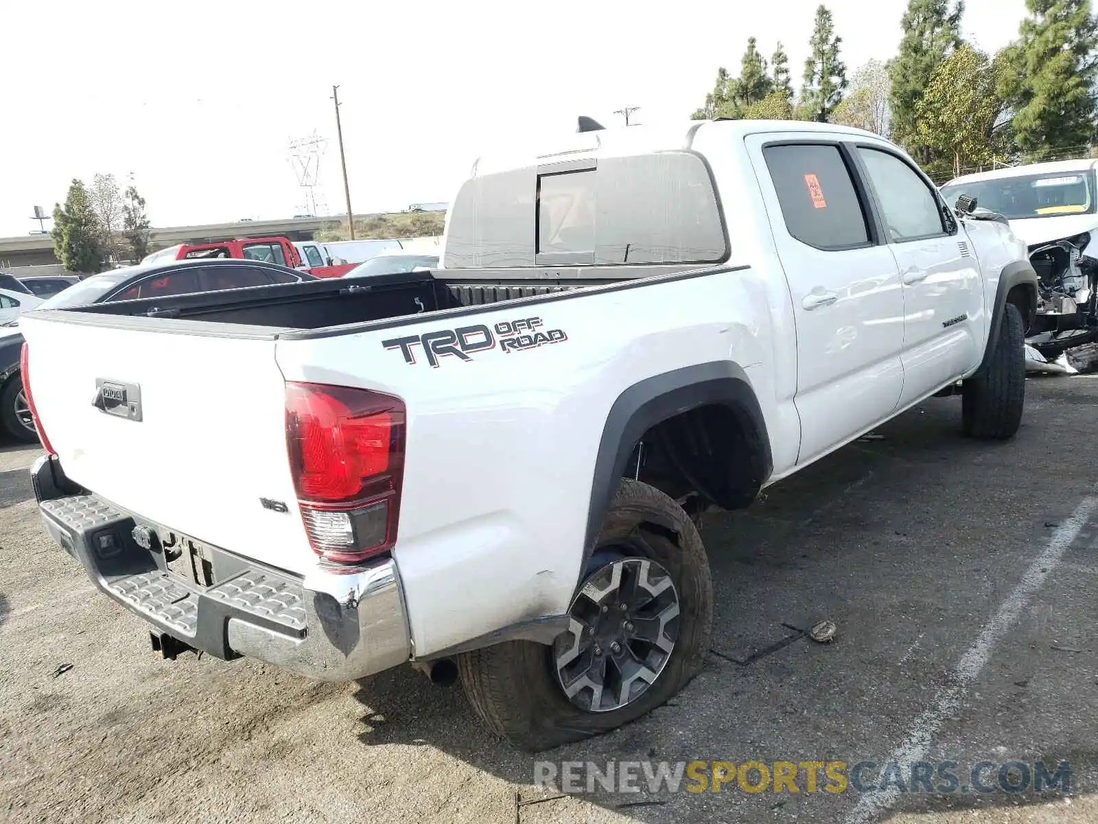 4 Photograph of a damaged car 3TMAZ5CN3KM097662 TOYOTA TACOMA 2019