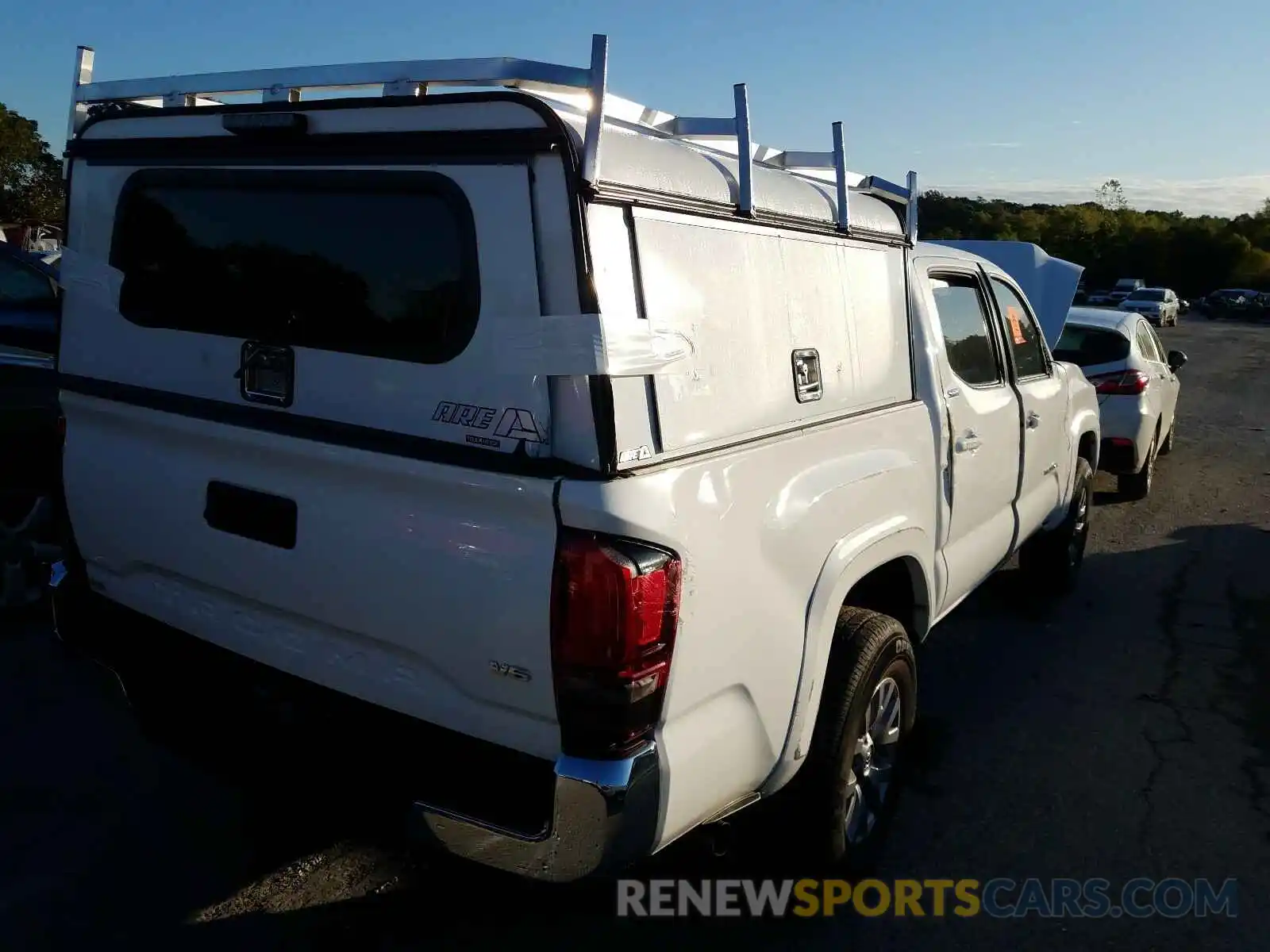 4 Photograph of a damaged car 3TMAZ5CN3KM110829 TOYOTA TACOMA 2019