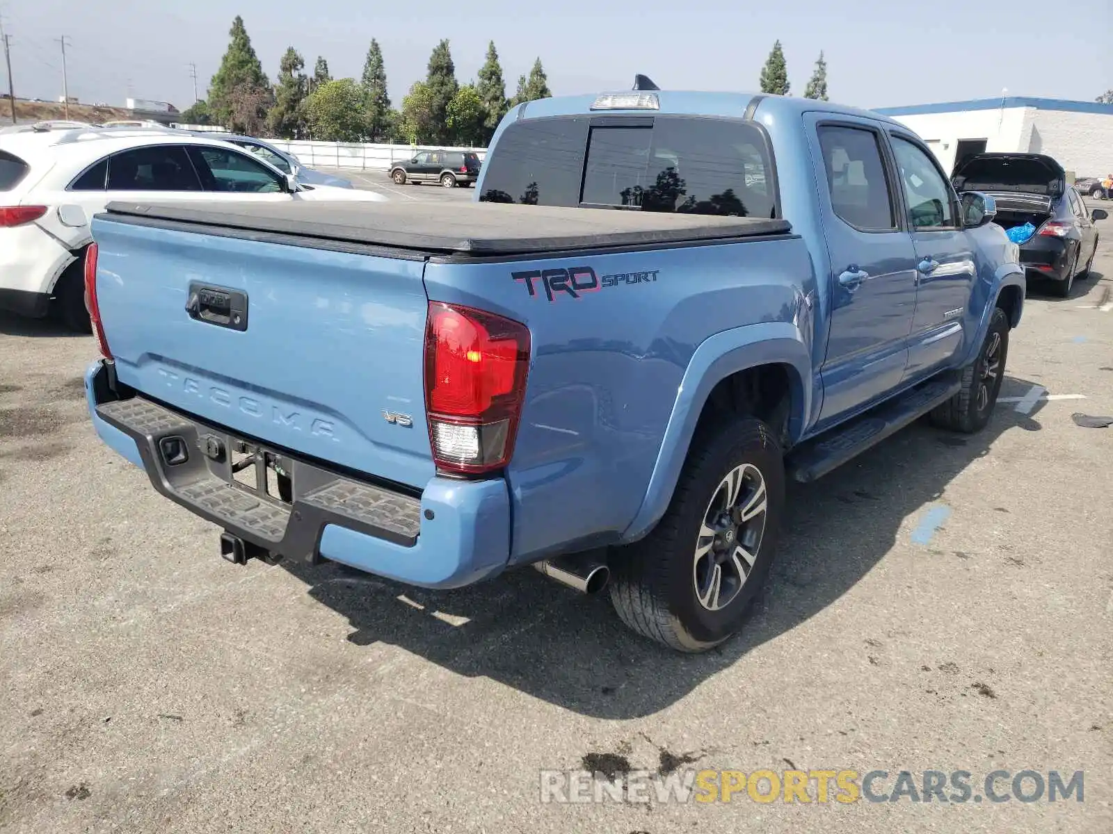 4 Photograph of a damaged car 3TMAZ5CN4KM079963 TOYOTA TACOMA 2019