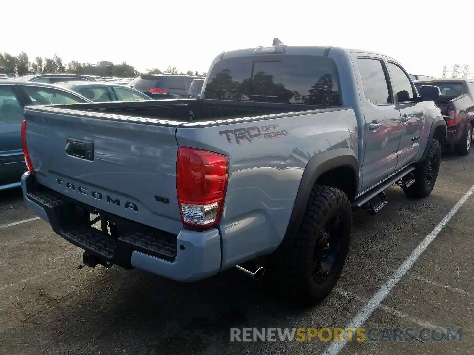 4 Photograph of a damaged car 3TMAZ5CN4KM083270 TOYOTA TACOMA 2019