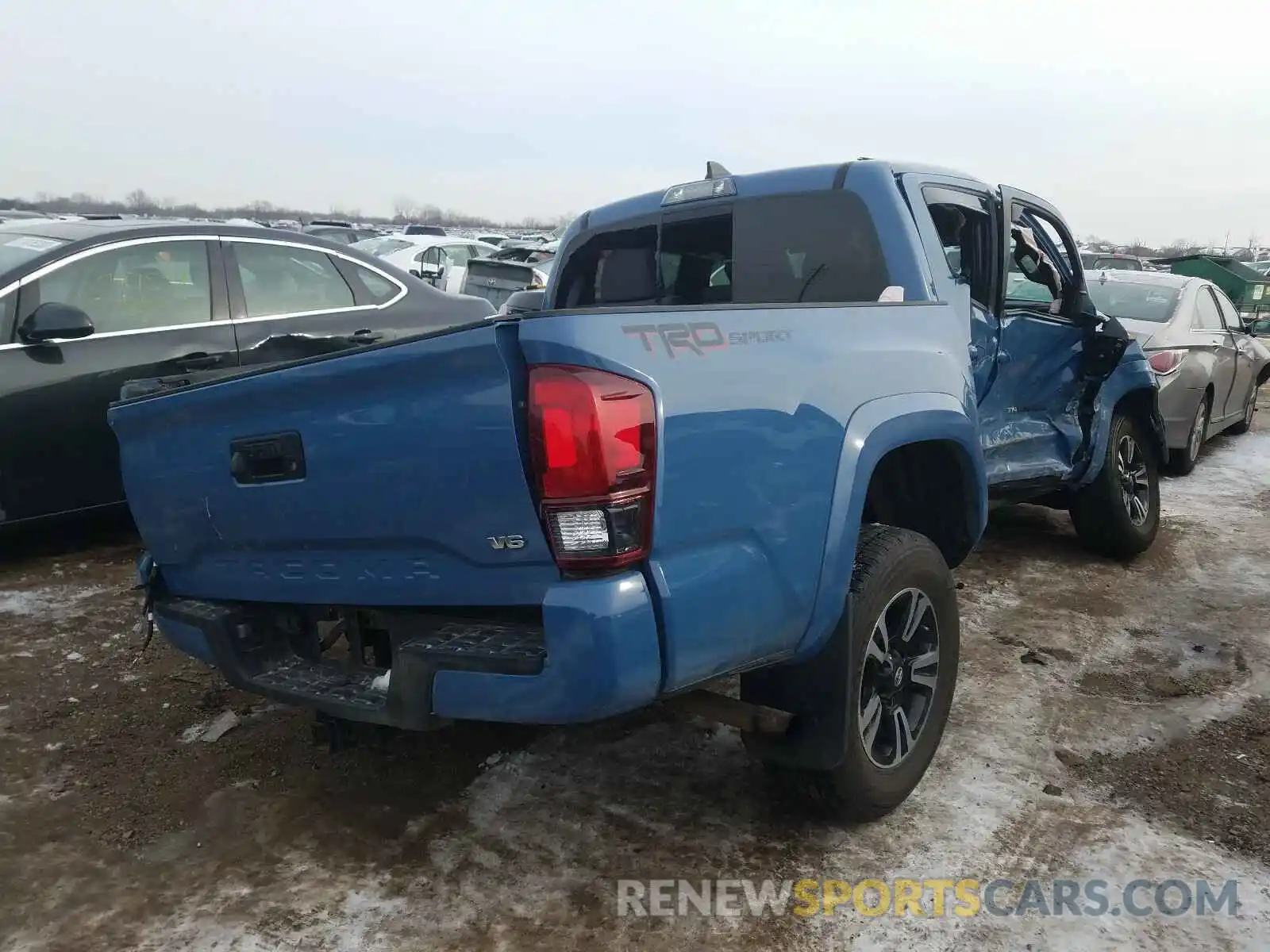 4 Photograph of a damaged car 3TMAZ5CN5KM102411 TOYOTA TACOMA 2019