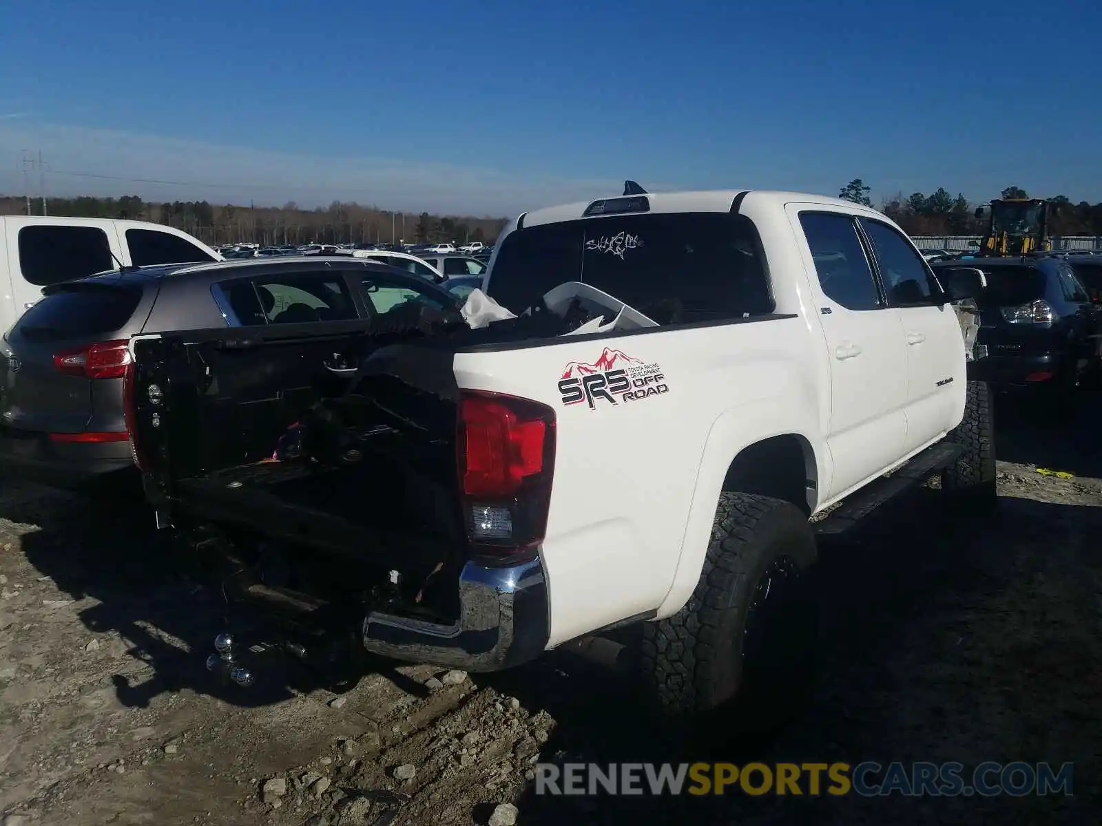 4 Photograph of a damaged car 3TMAZ5CN5KM102666 TOYOTA TACOMA 2019