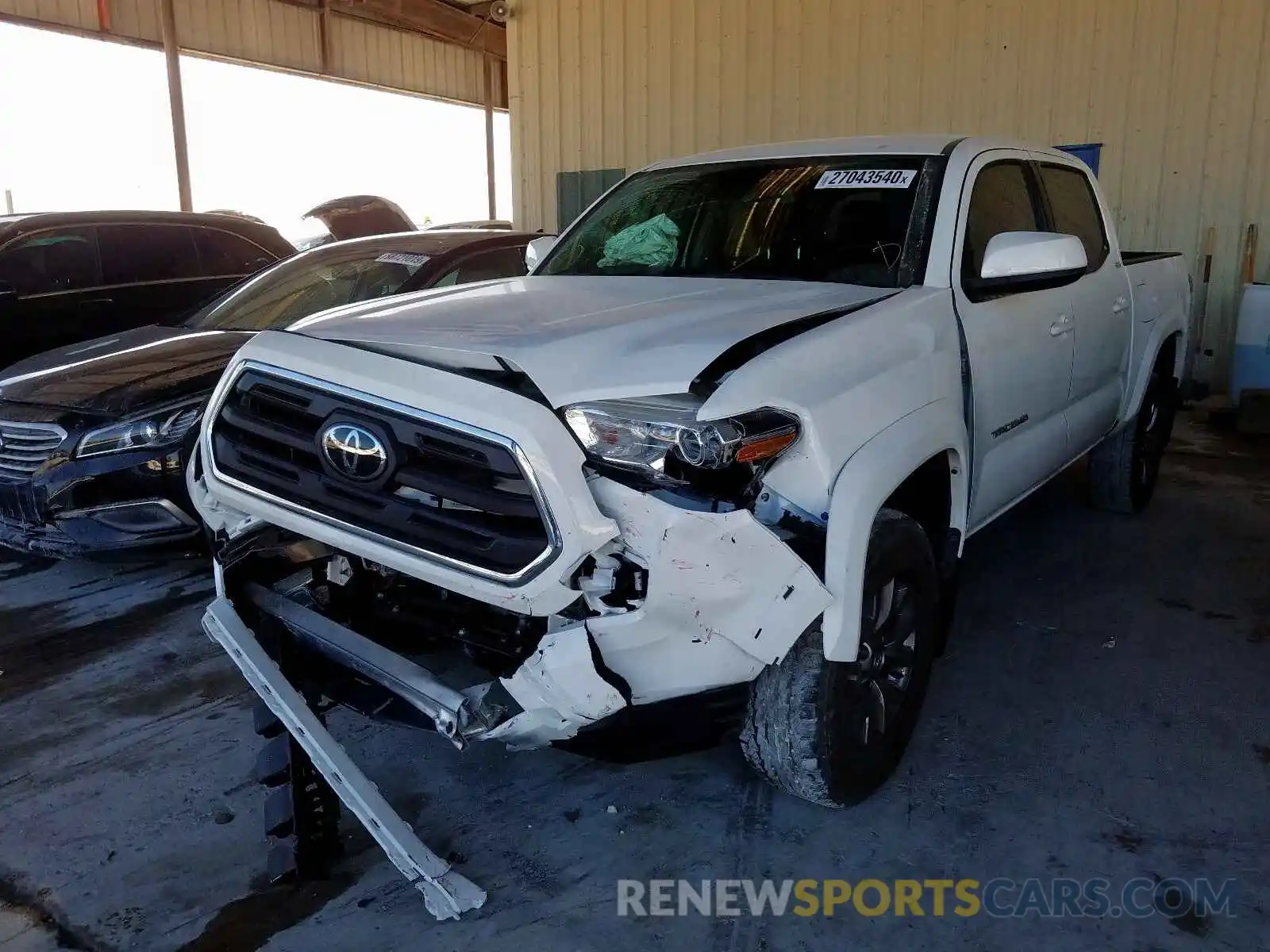 2 Photograph of a damaged car 3TMAZ5CN5KM102943 TOYOTA TACOMA 2019