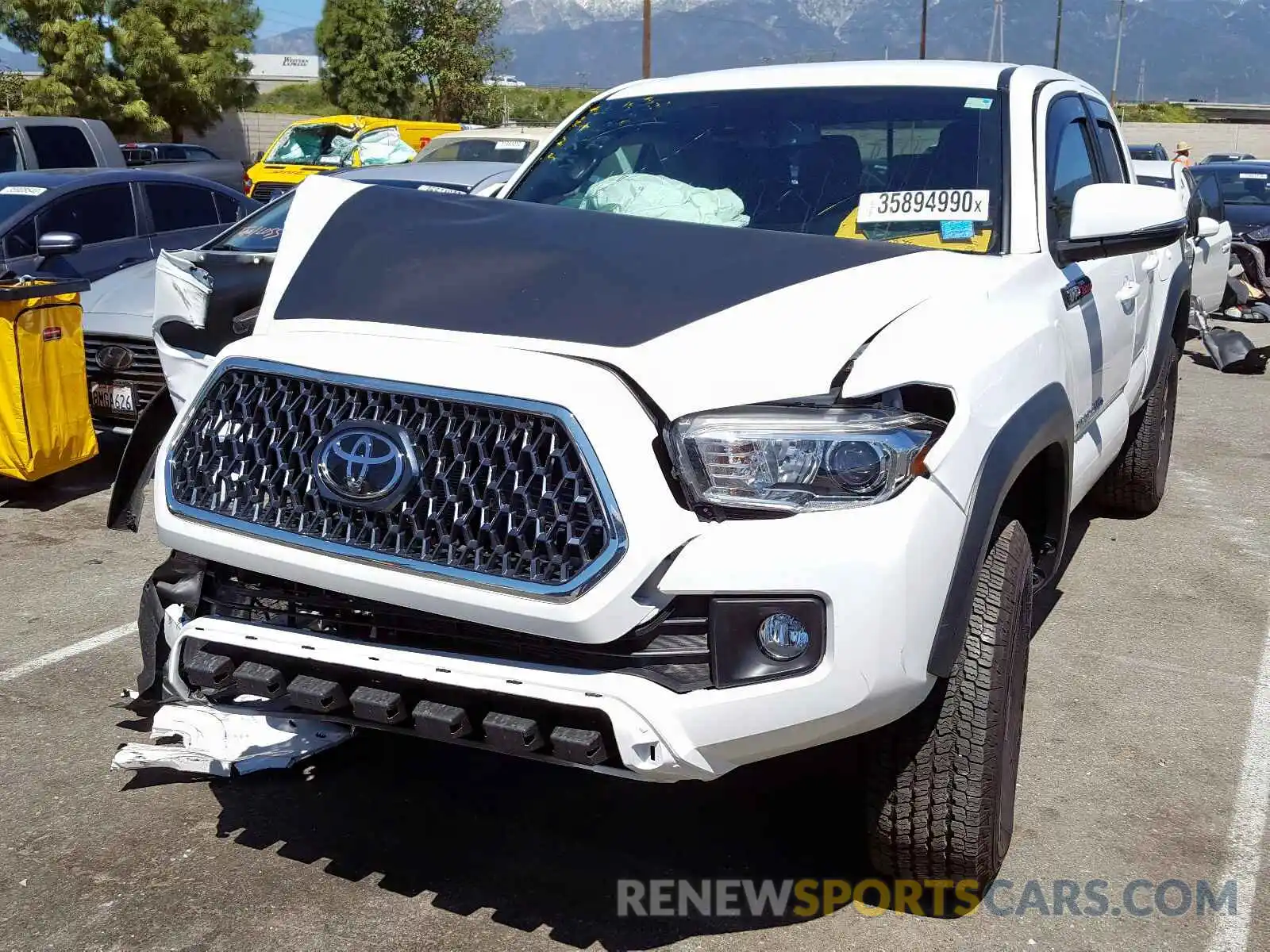 2 Photograph of a damaged car 3TMAZ5CN5KM104711 TOYOTA TACOMA 2019