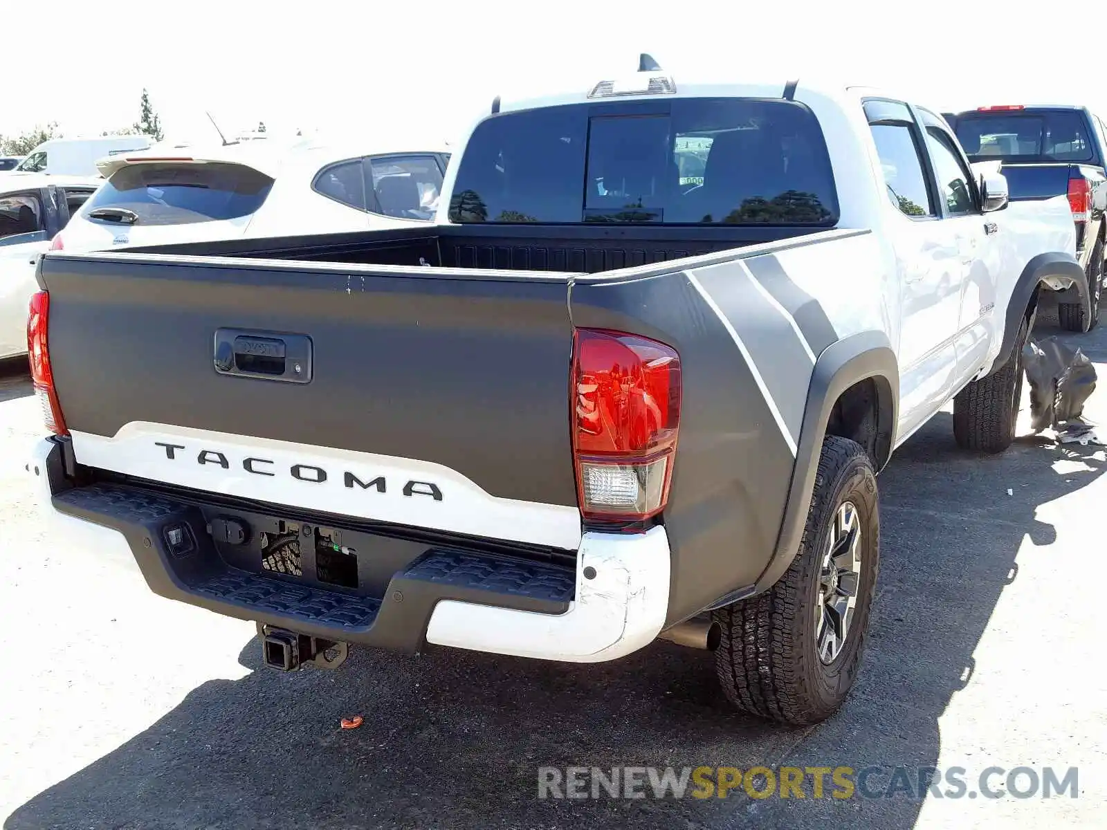 4 Photograph of a damaged car 3TMAZ5CN5KM104711 TOYOTA TACOMA 2019