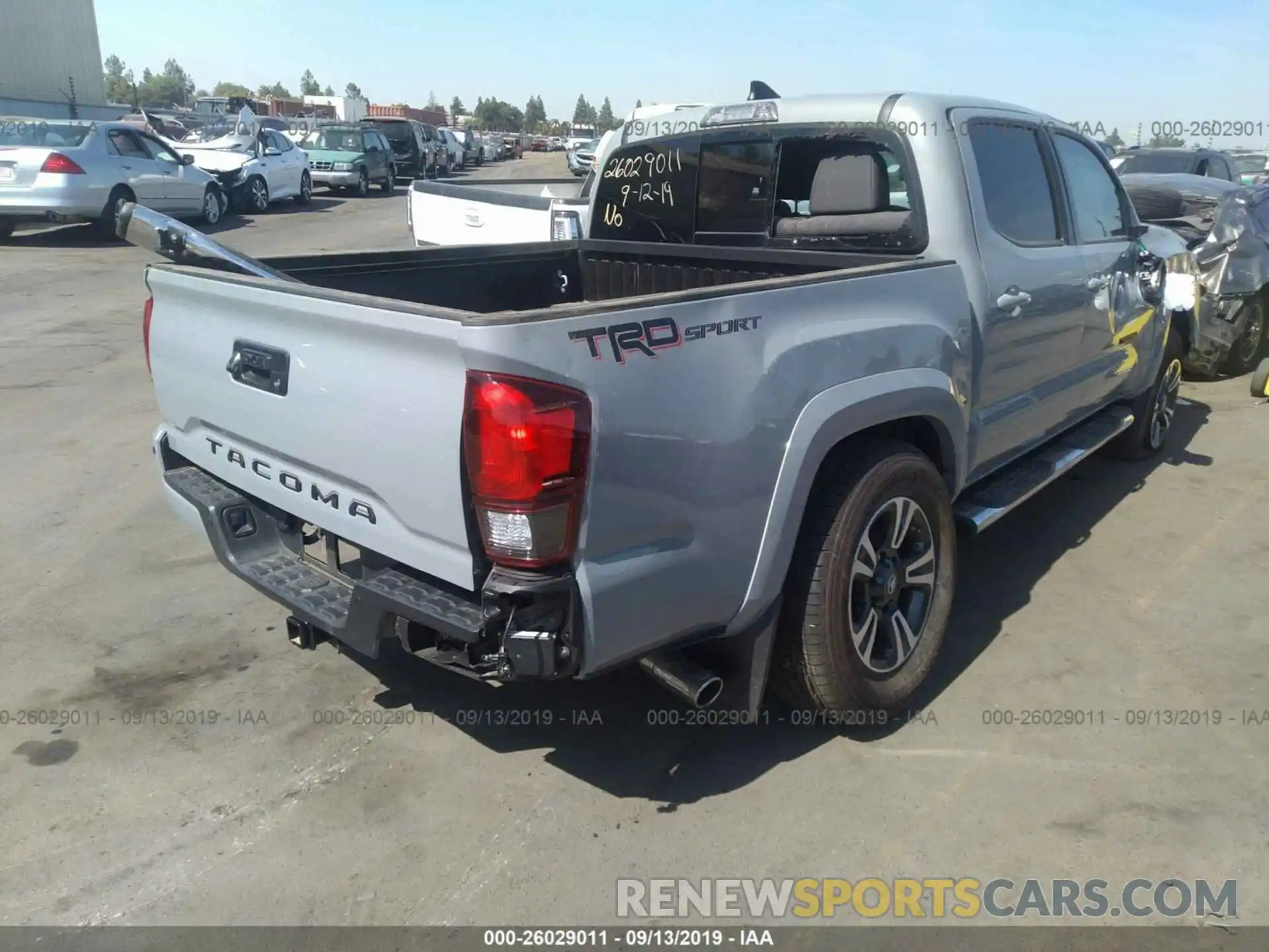 4 Photograph of a damaged car 3TMAZ5CN5KM104997 TOYOTA TACOMA 2019