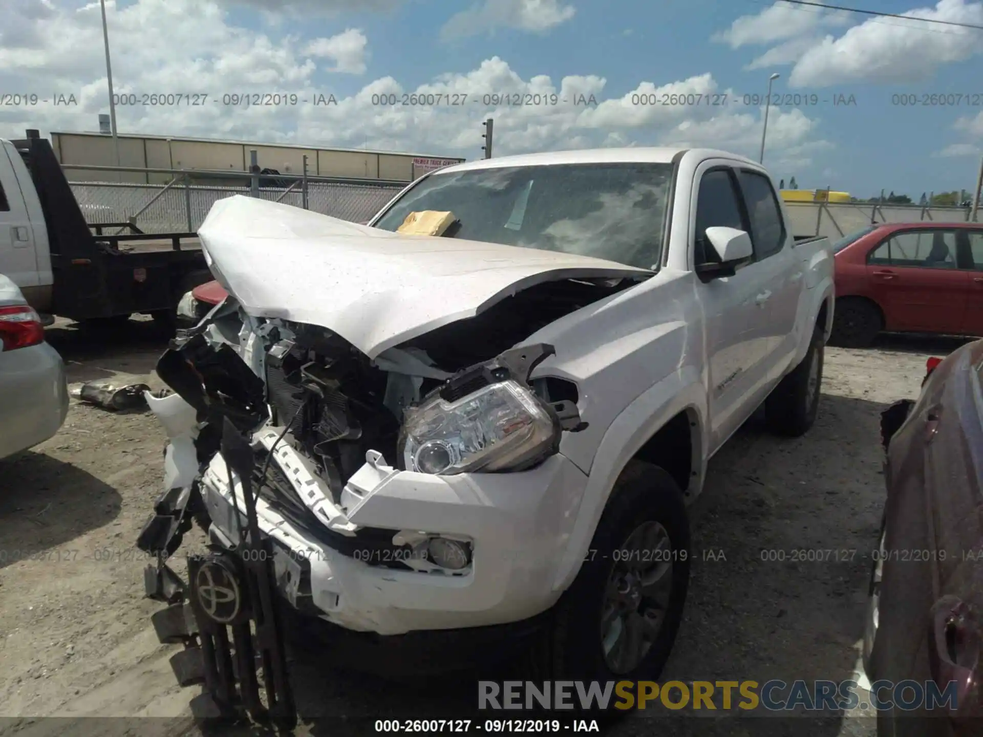 2 Photograph of a damaged car 3TMAZ5CN5KM106992 TOYOTA TACOMA 2019