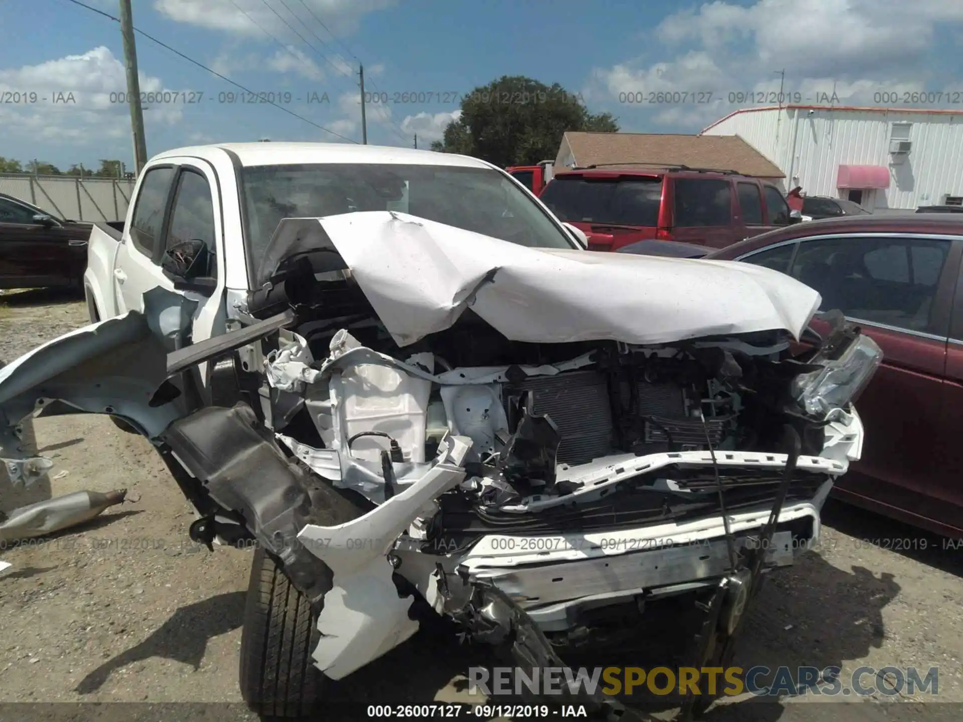 6 Photograph of a damaged car 3TMAZ5CN5KM106992 TOYOTA TACOMA 2019