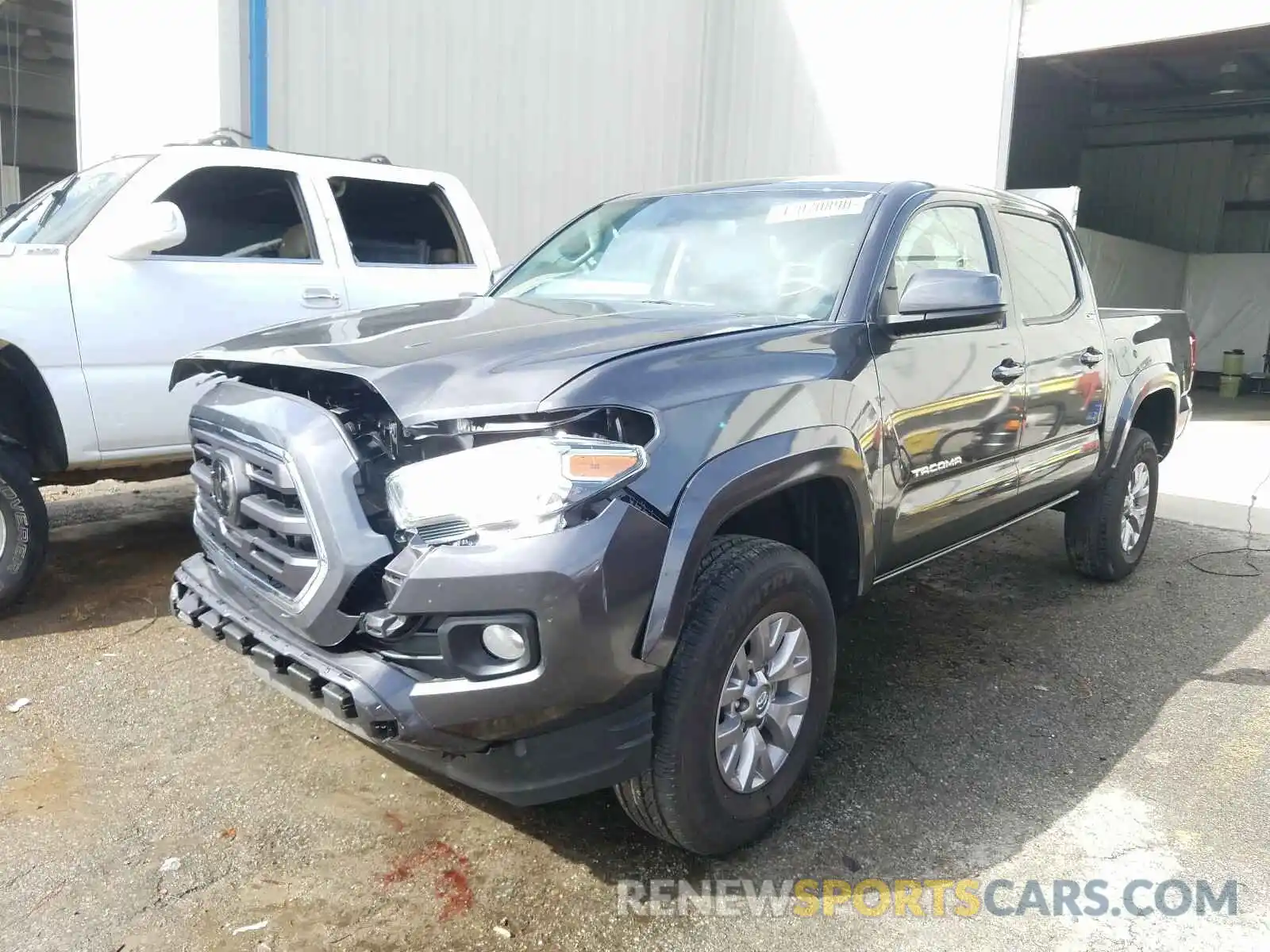 2 Photograph of a damaged car 3TMAZ5CN5KM112680 TOYOTA TACOMA 2019