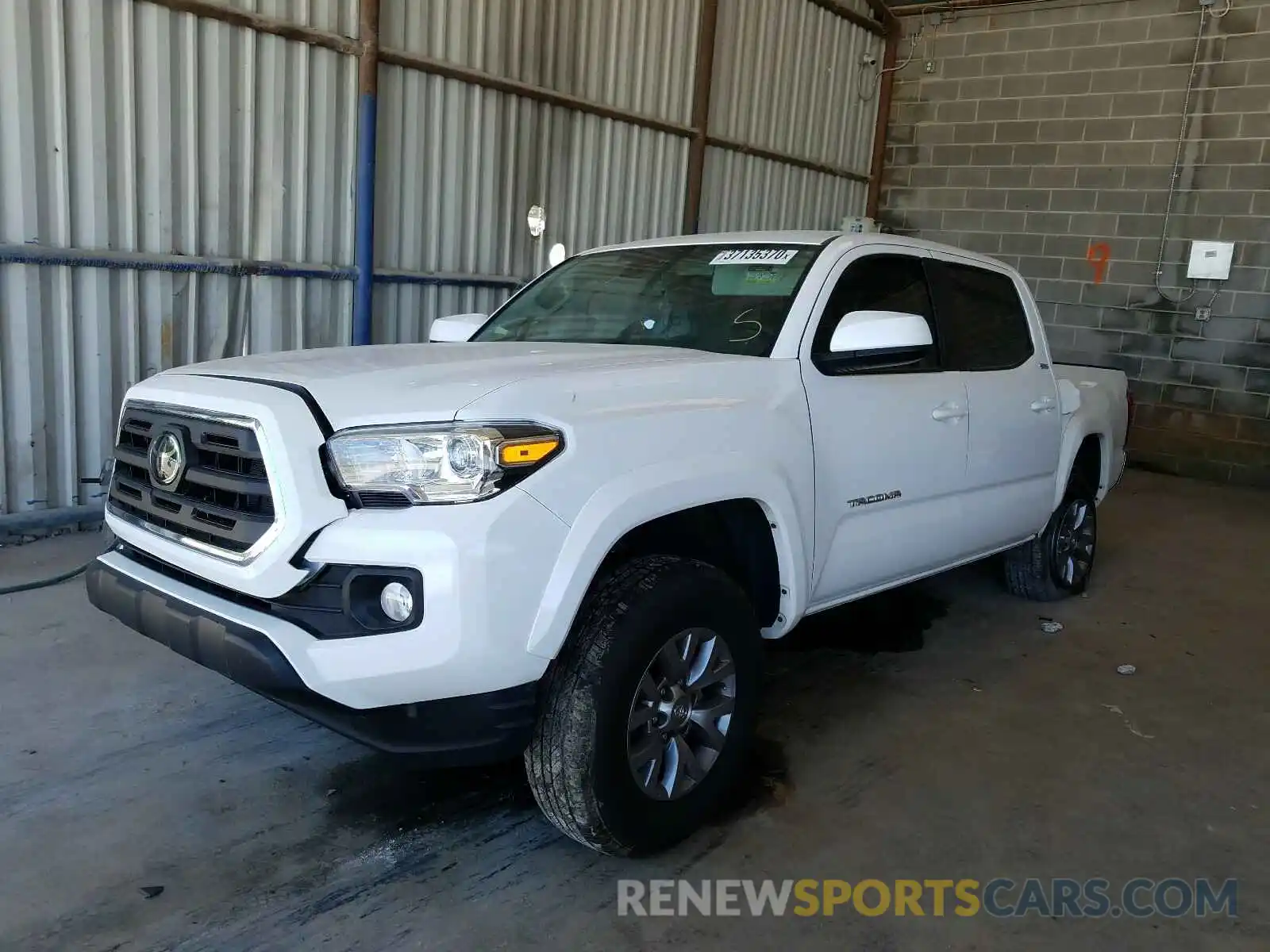 2 Photograph of a damaged car 3TMAZ5CN6KM111375 TOYOTA TACOMA 2019