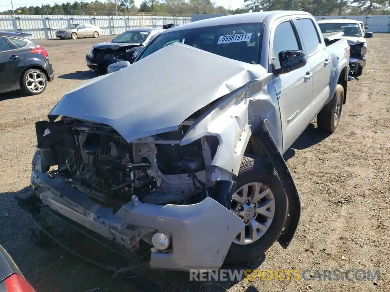 2 Photograph of a damaged car 3TMAZ5CN7KM094201 TOYOTA TACOMA 2019