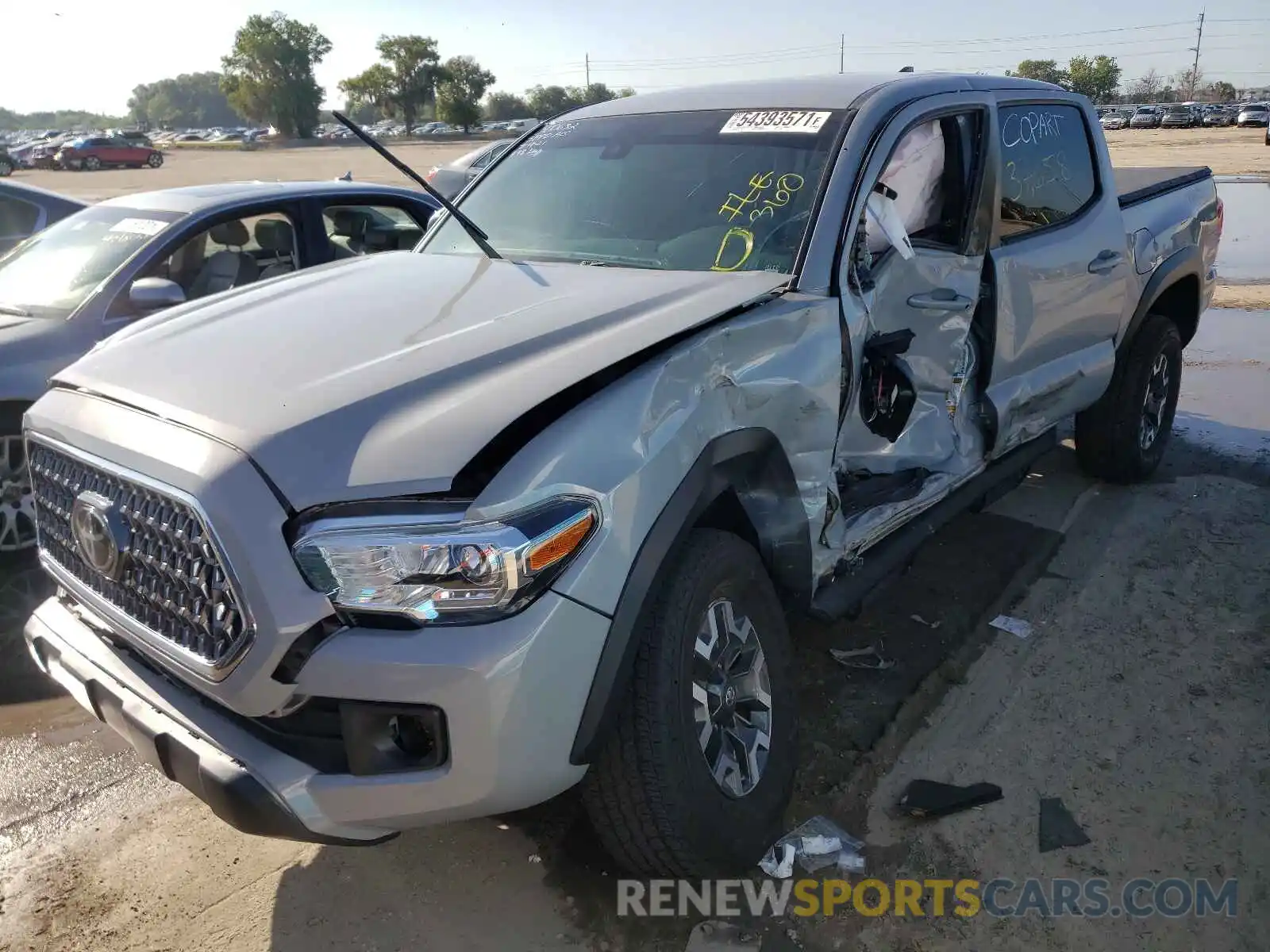 2 Photograph of a damaged car 3TMAZ5CN7KM102975 TOYOTA TACOMA 2019