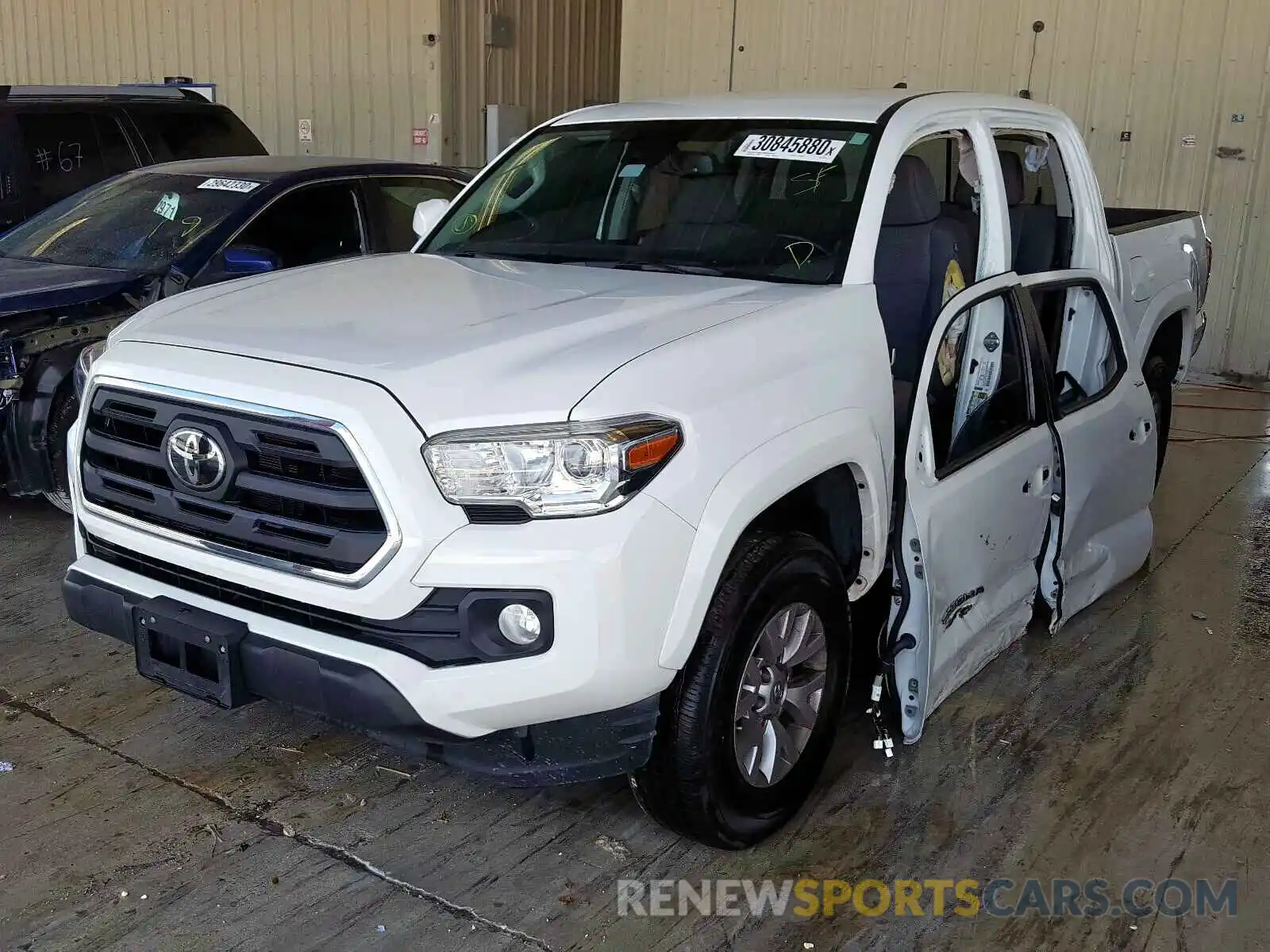 2 Photograph of a damaged car 3TMAZ5CN9KM097410 TOYOTA TACOMA 2019