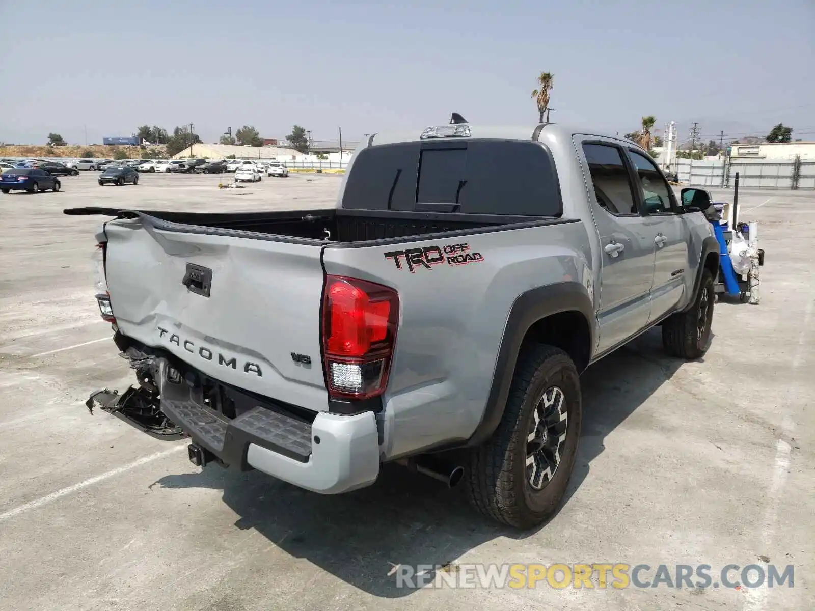 4 Photograph of a damaged car 3TMAZ5CN9KM101858 TOYOTA TACOMA 2019