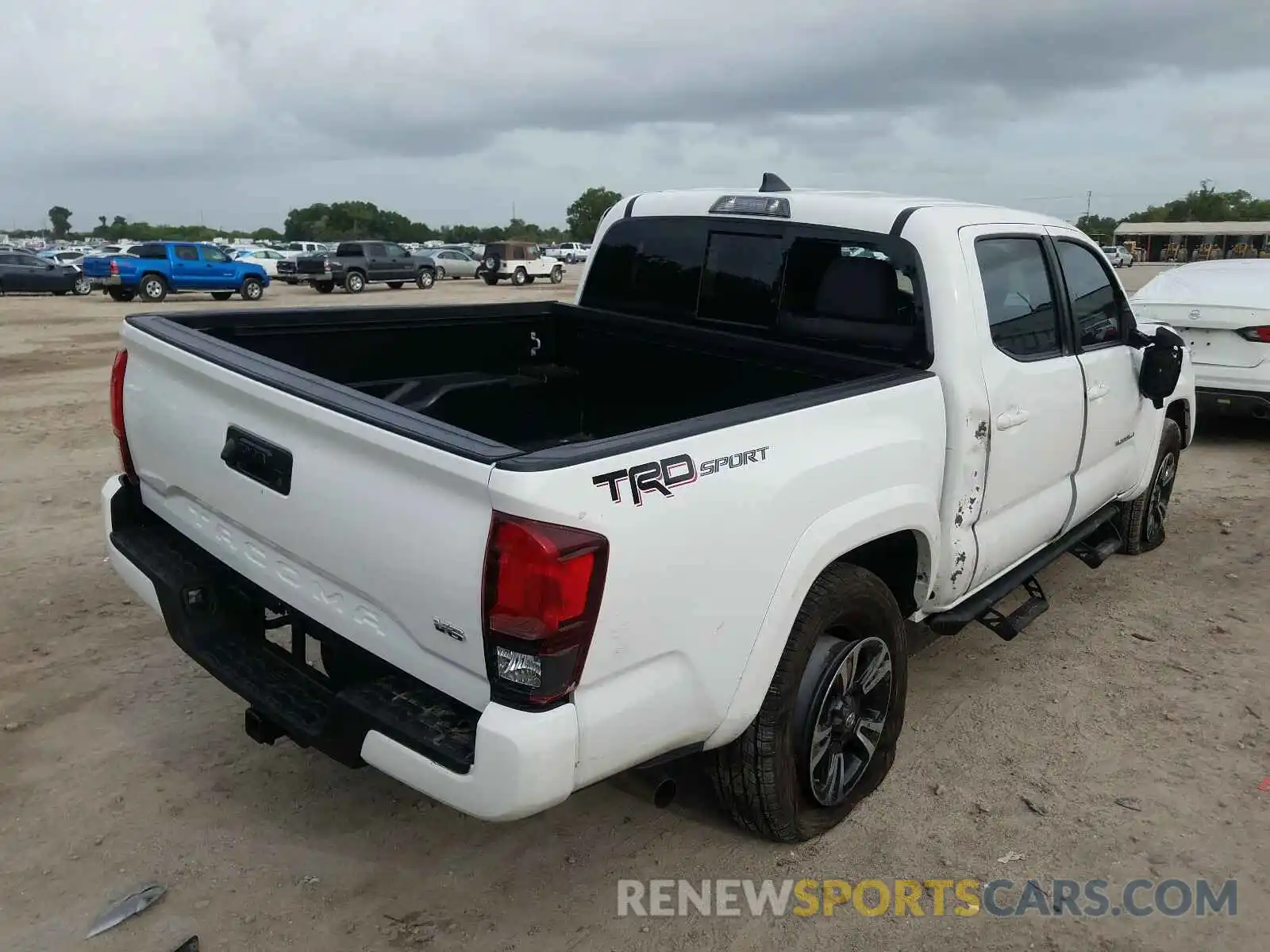 4 Photograph of a damaged car 3TMAZ5CN9KM110060 TOYOTA TACOMA 2019