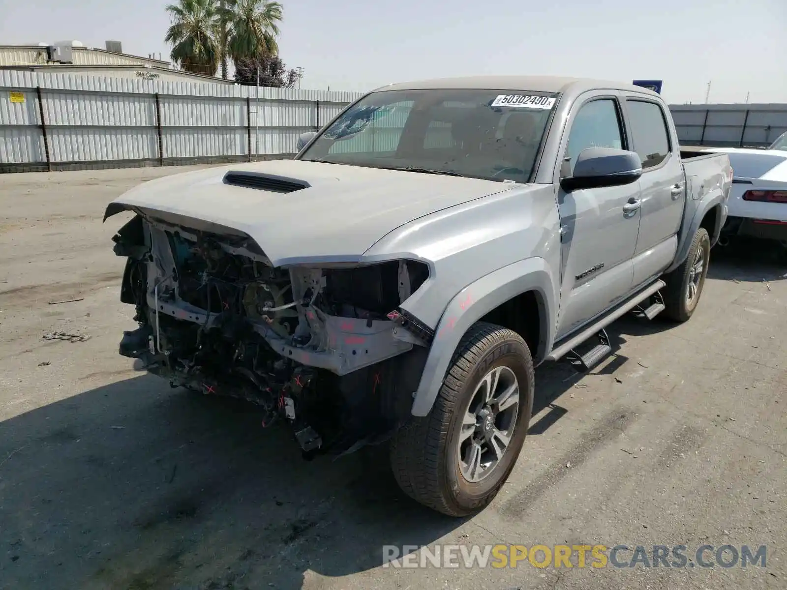 2 Photograph of a damaged car 3TMAZ5CN9KM111824 TOYOTA TACOMA 2019