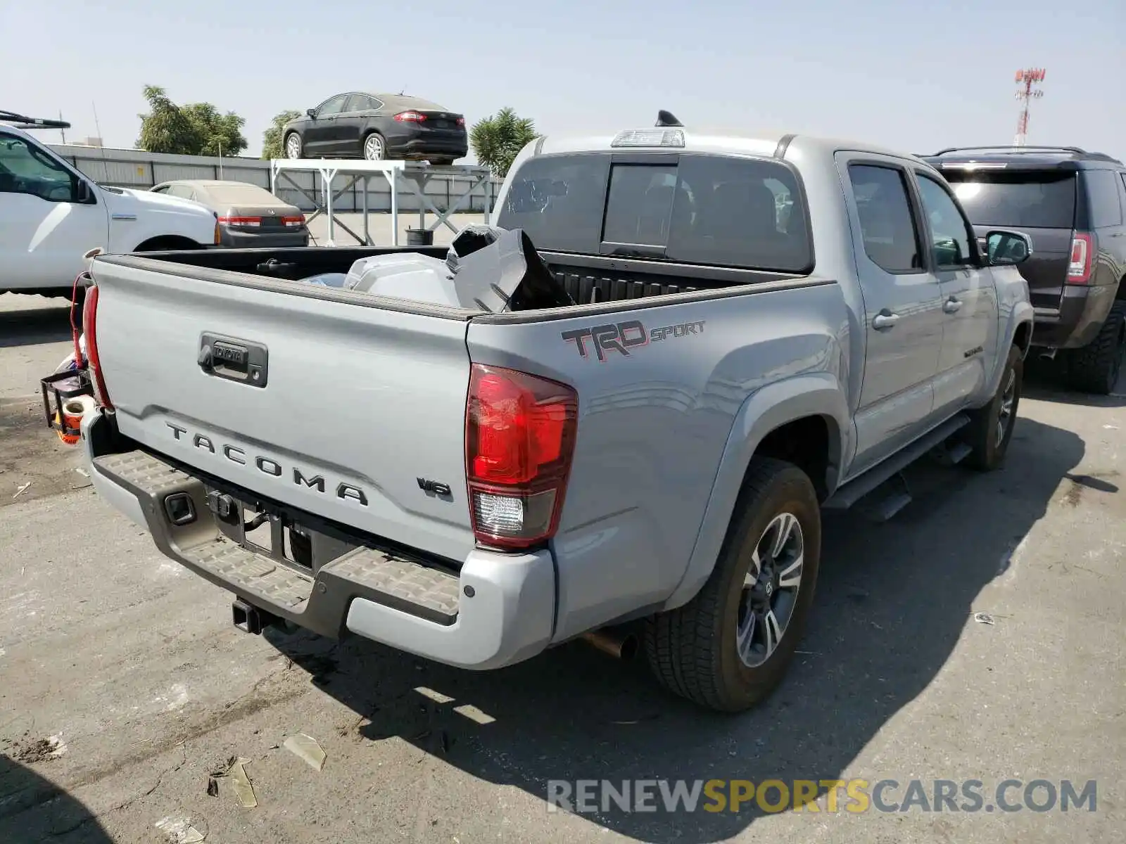 4 Photograph of a damaged car 3TMAZ5CN9KM111824 TOYOTA TACOMA 2019