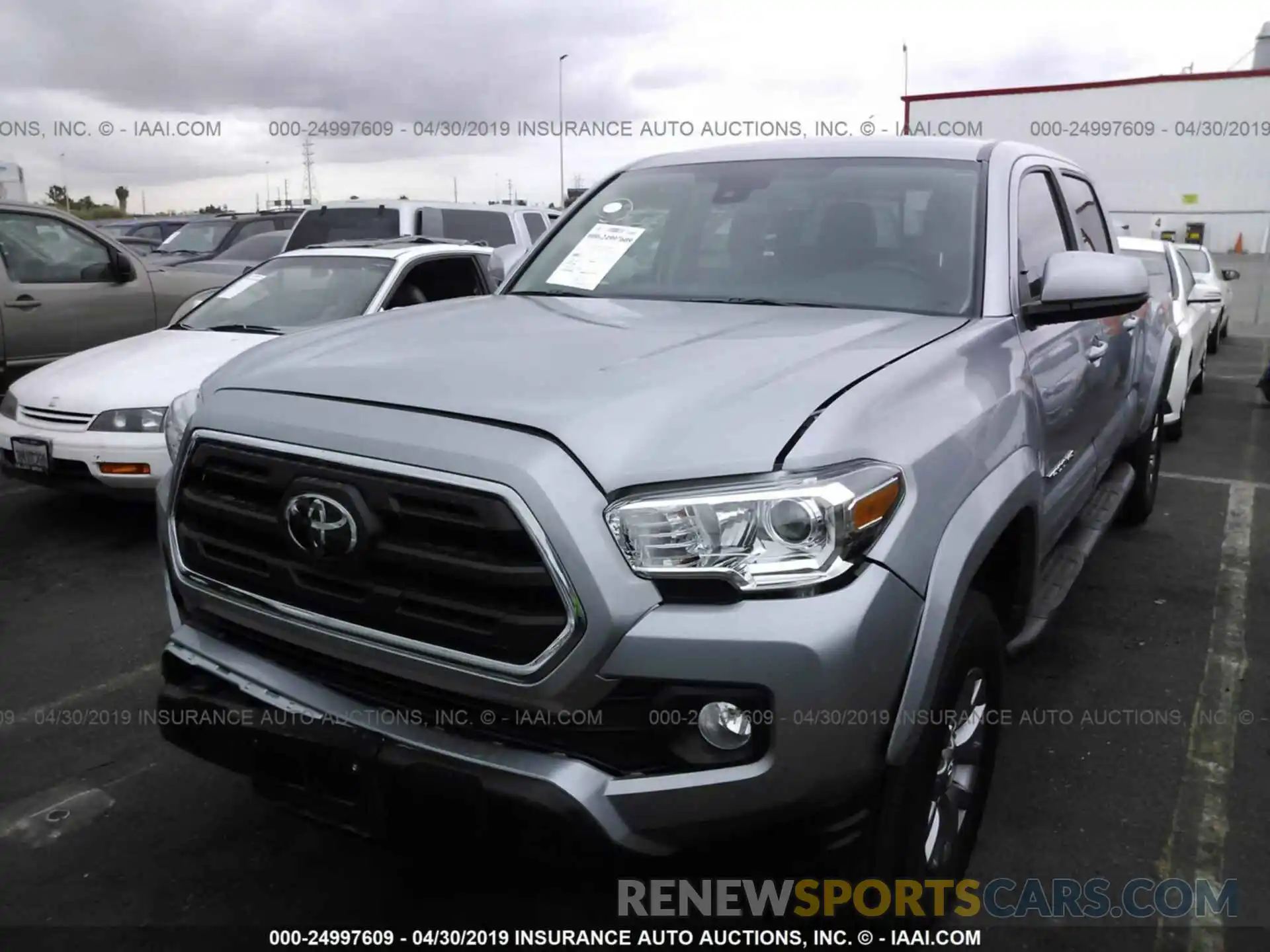 2 Photograph of a damaged car 3TMBZ5DN3KM018395 TOYOTA TACOMA 2019