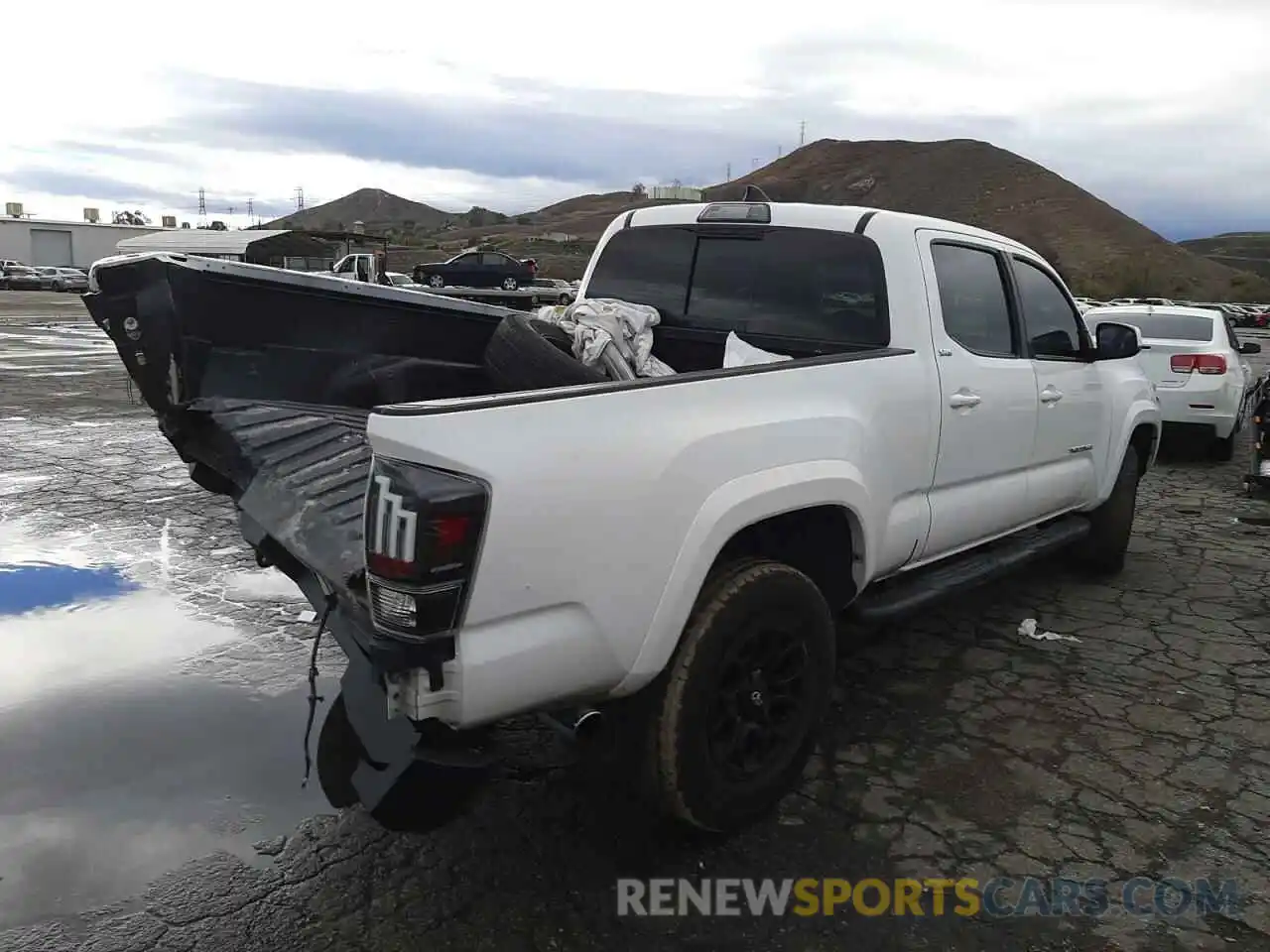 4 Photograph of a damaged car 3TMBZ5DN4KM019474 TOYOTA TACOMA 2019