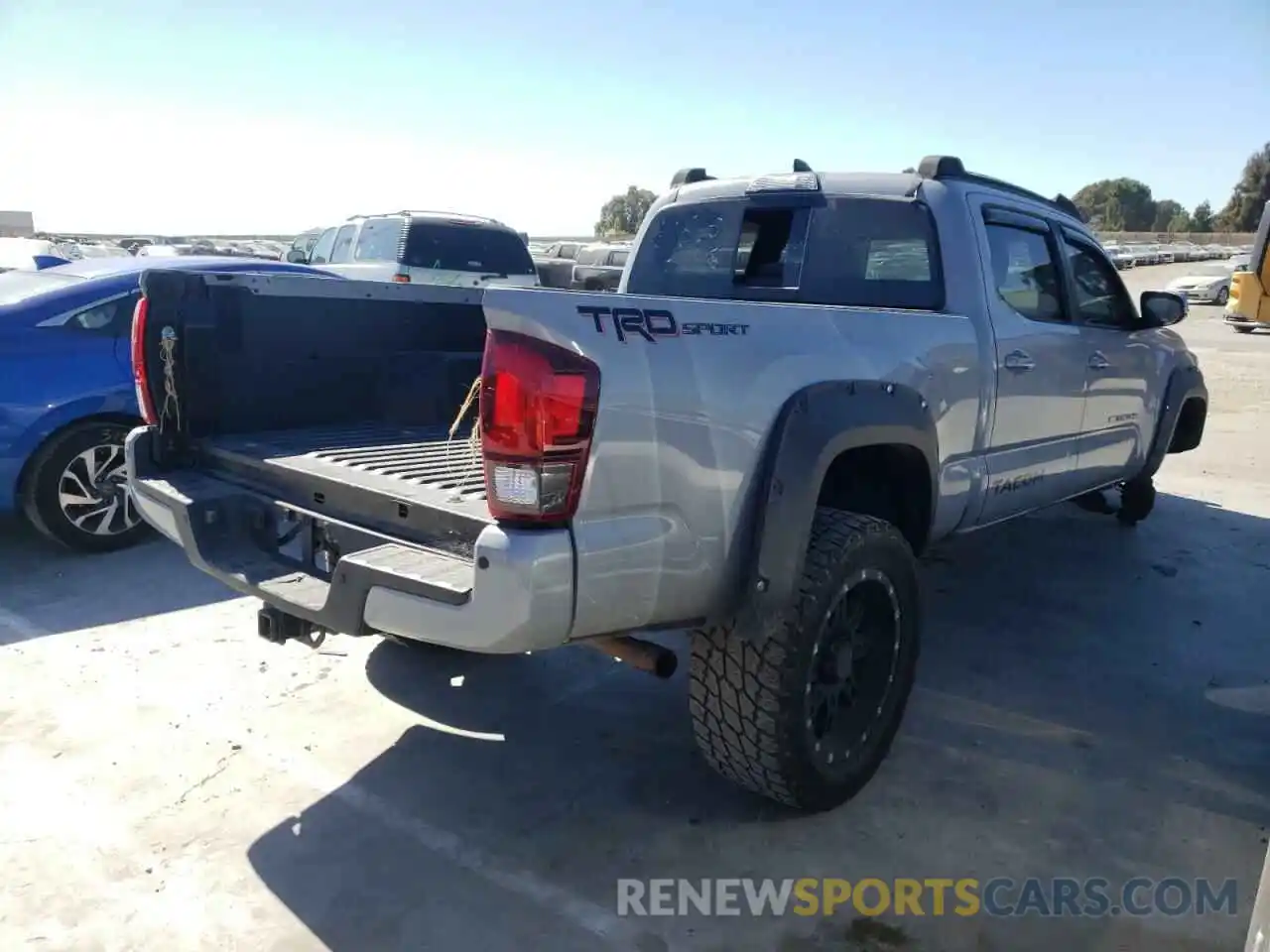 4 Photograph of a damaged car 3TMBZ5DN5KM018561 TOYOTA TACOMA 2019