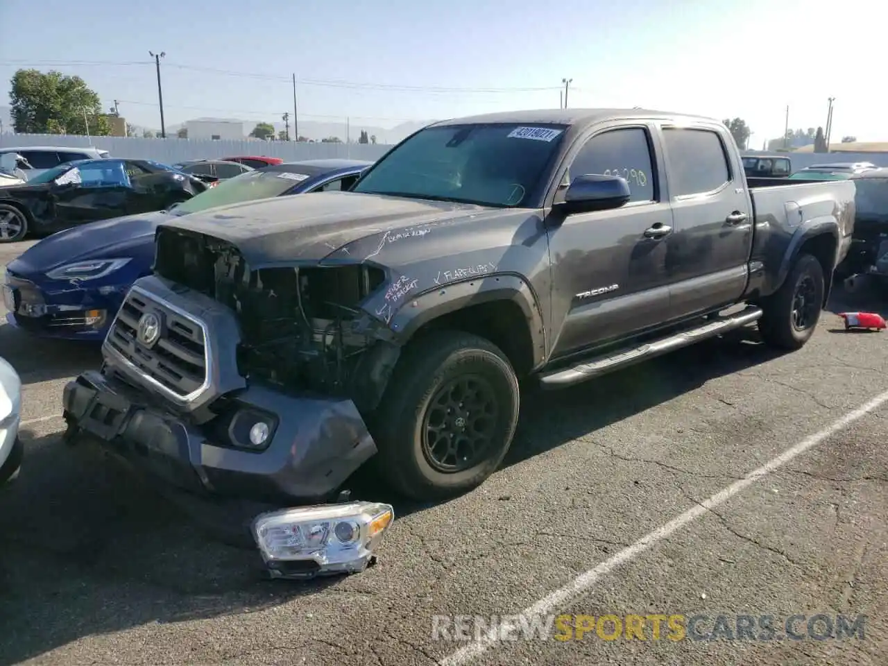 2 Photograph of a damaged car 3TMBZ5DN5KM019094 TOYOTA TACOMA 2019