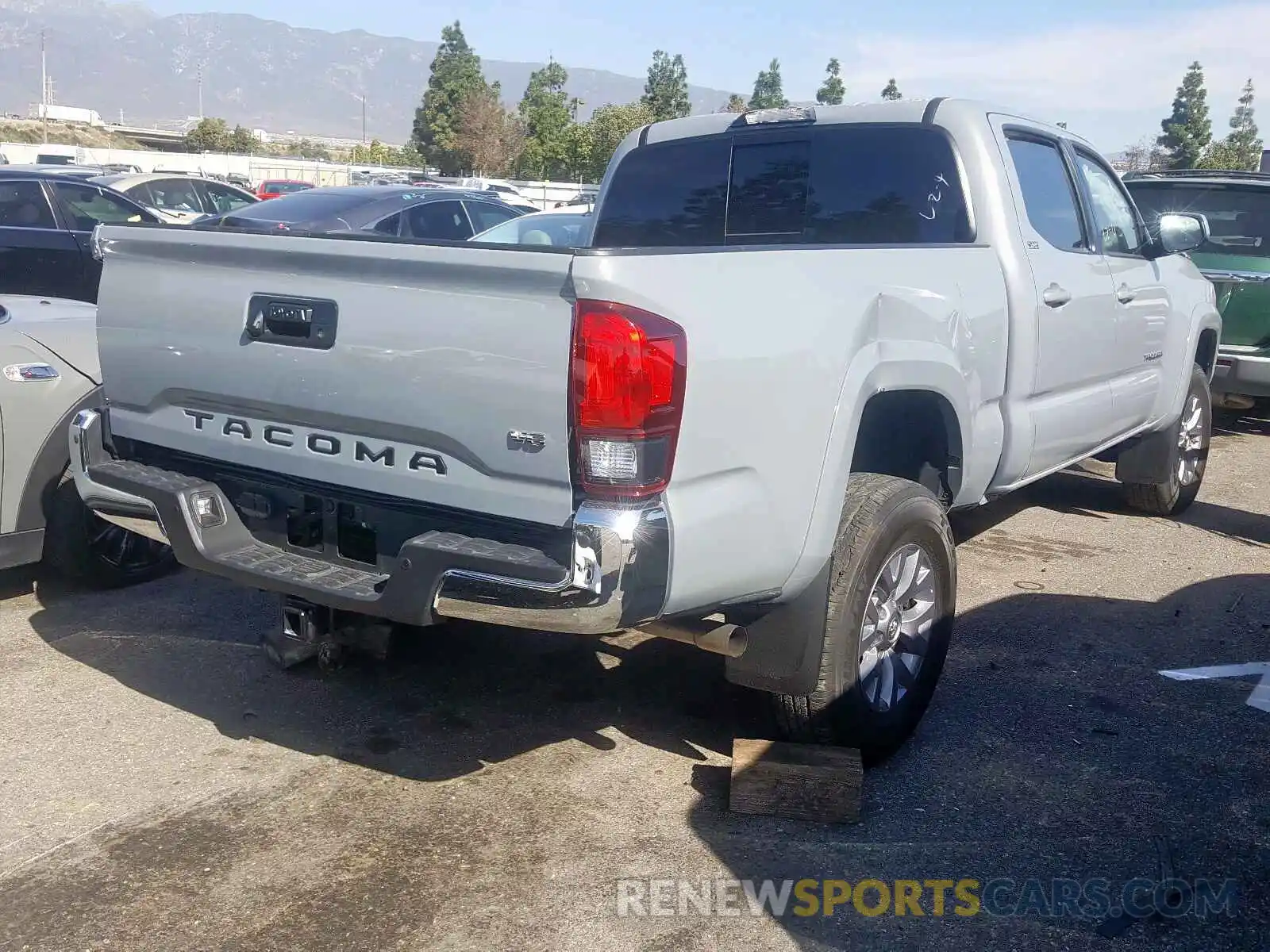 4 Photograph of a damaged car 3TMBZ5DN6KM023154 TOYOTA TACOMA 2019