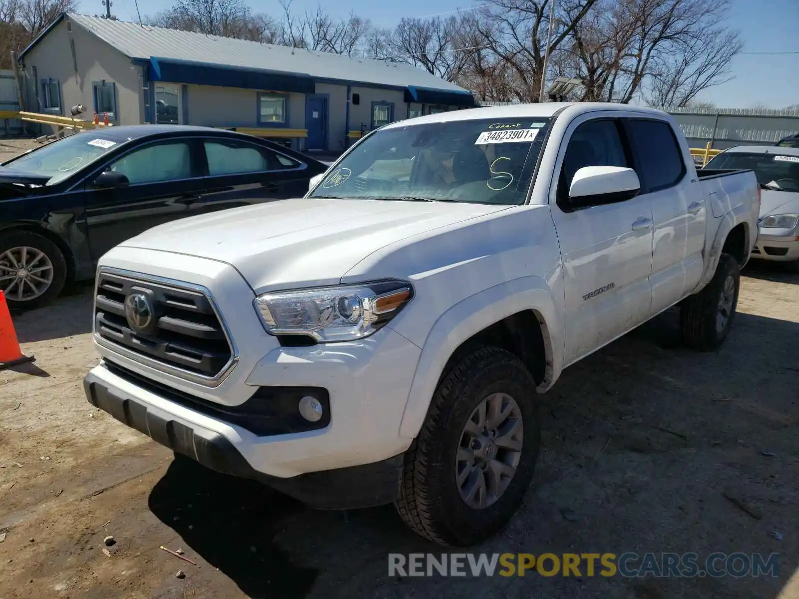 2 Photograph of a damaged car 3TMCZ5AN0KM233032 TOYOTA TACOMA 2019