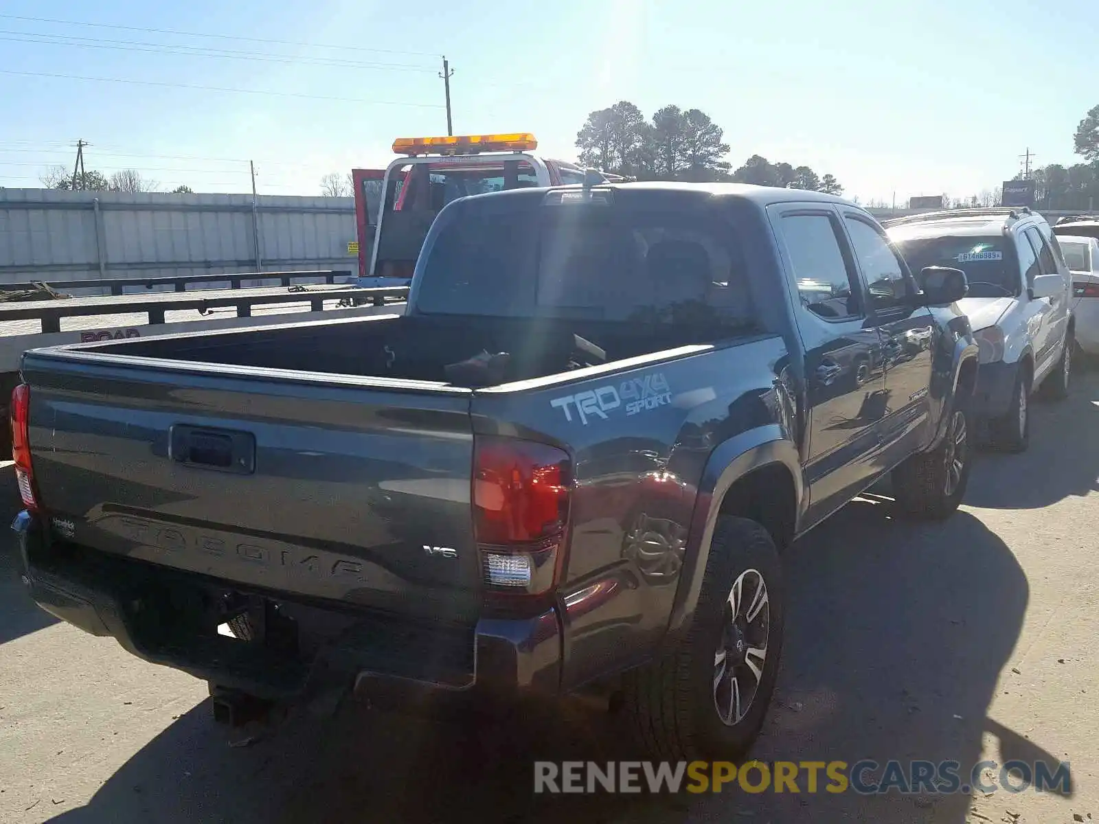 4 Photograph of a damaged car 3TMCZ5AN0KM233371 TOYOTA TACOMA 2019