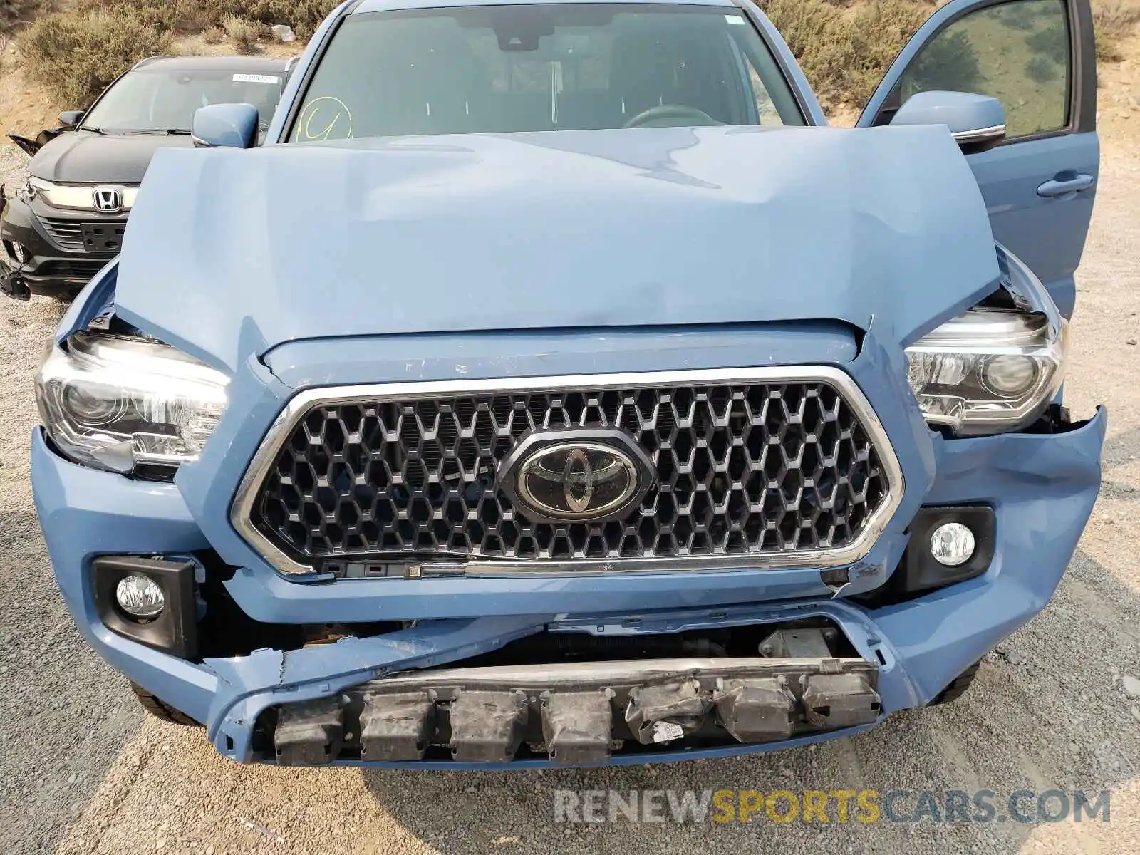 7 Photograph of a damaged car 3TMCZ5AN0KM237212 TOYOTA TACOMA 2019