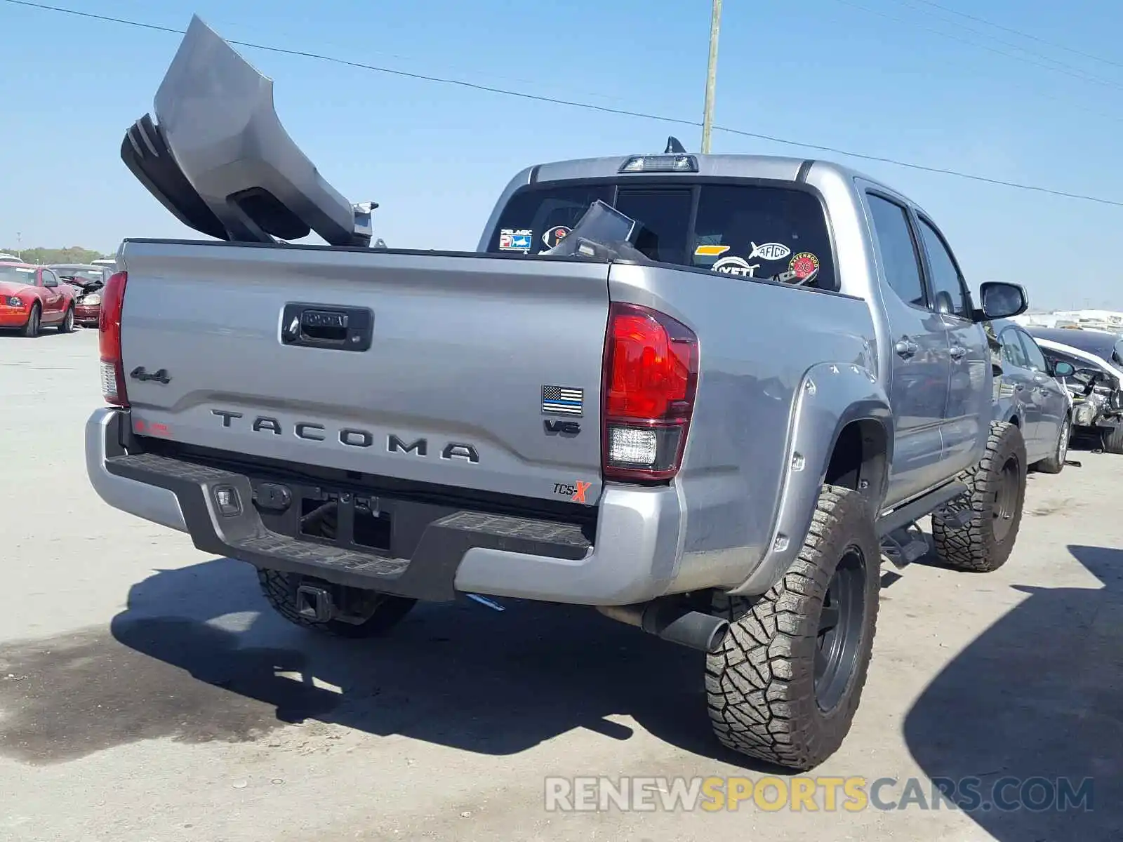 4 Photograph of a damaged car 3TMCZ5AN1KM235758 TOYOTA TACOMA 2019