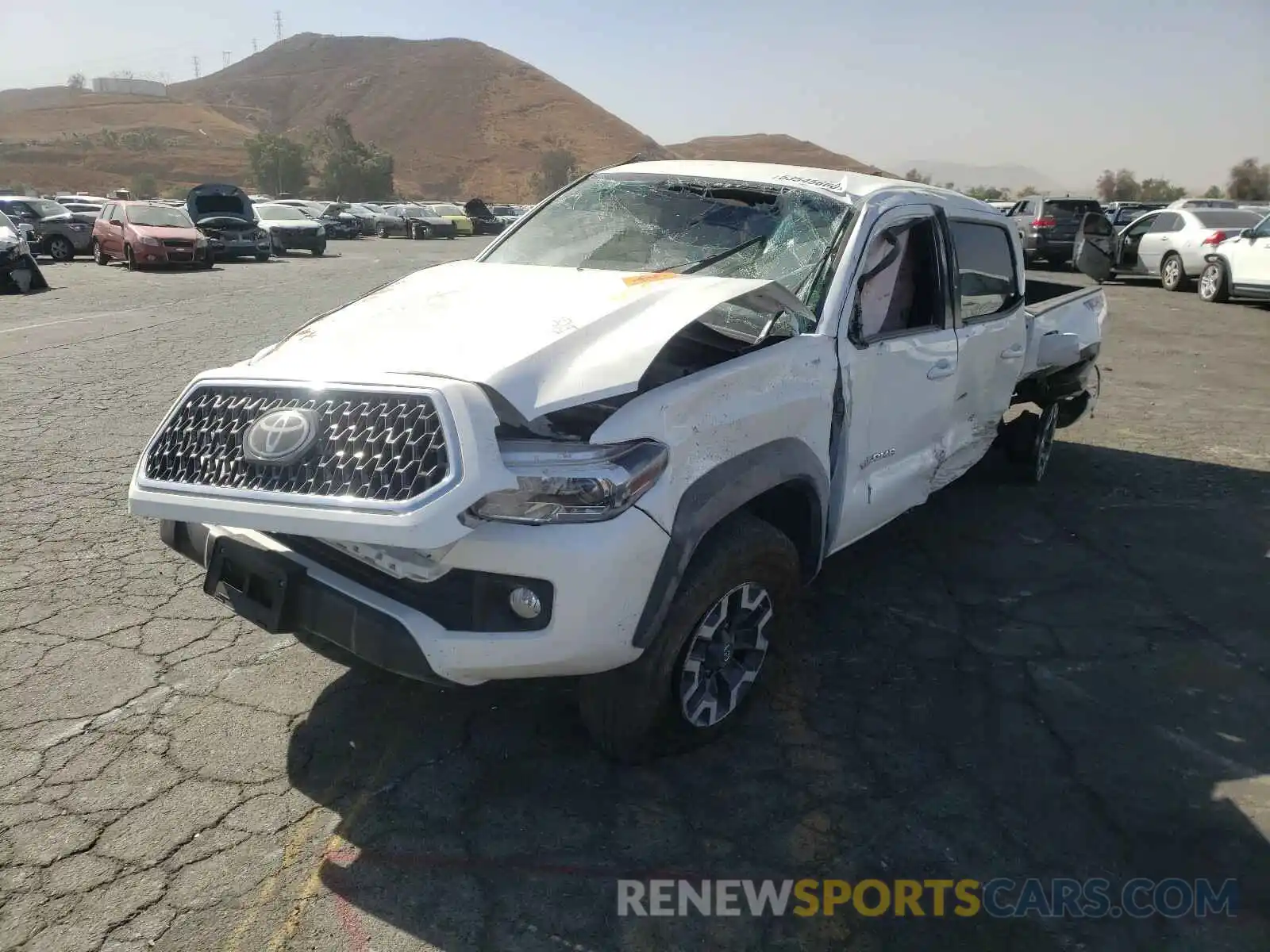 2 Photograph of a damaged car 3TMCZ5AN2KM239642 TOYOTA TACOMA 2019