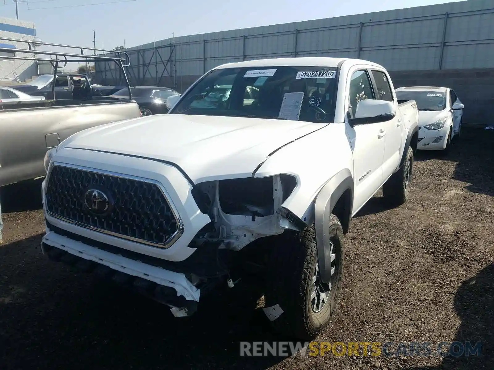 2 Photograph of a damaged car 3TMCZ5AN2KM256831 TOYOTA TACOMA 2019