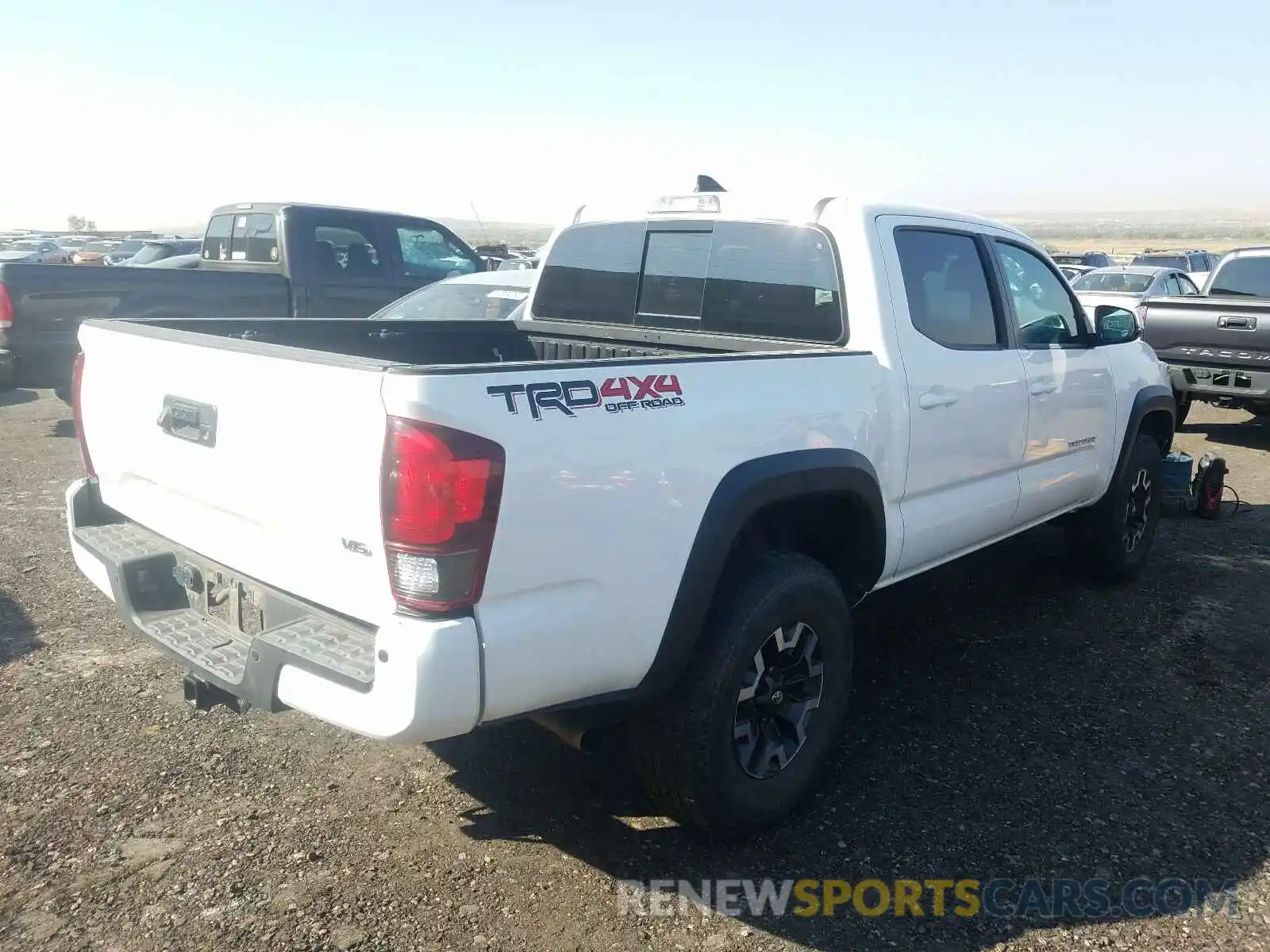 4 Photograph of a damaged car 3TMCZ5AN2KM256831 TOYOTA TACOMA 2019