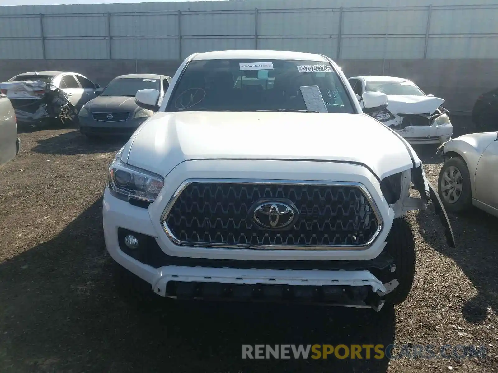 9 Photograph of a damaged car 3TMCZ5AN2KM256831 TOYOTA TACOMA 2019