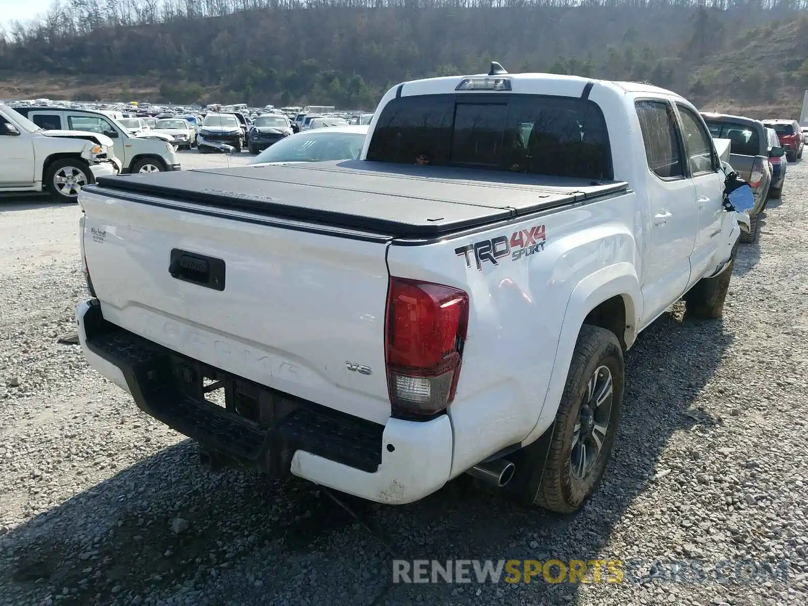 4 Photograph of a damaged car 3TMCZ5AN2KM271846 TOYOTA TACOMA 2019