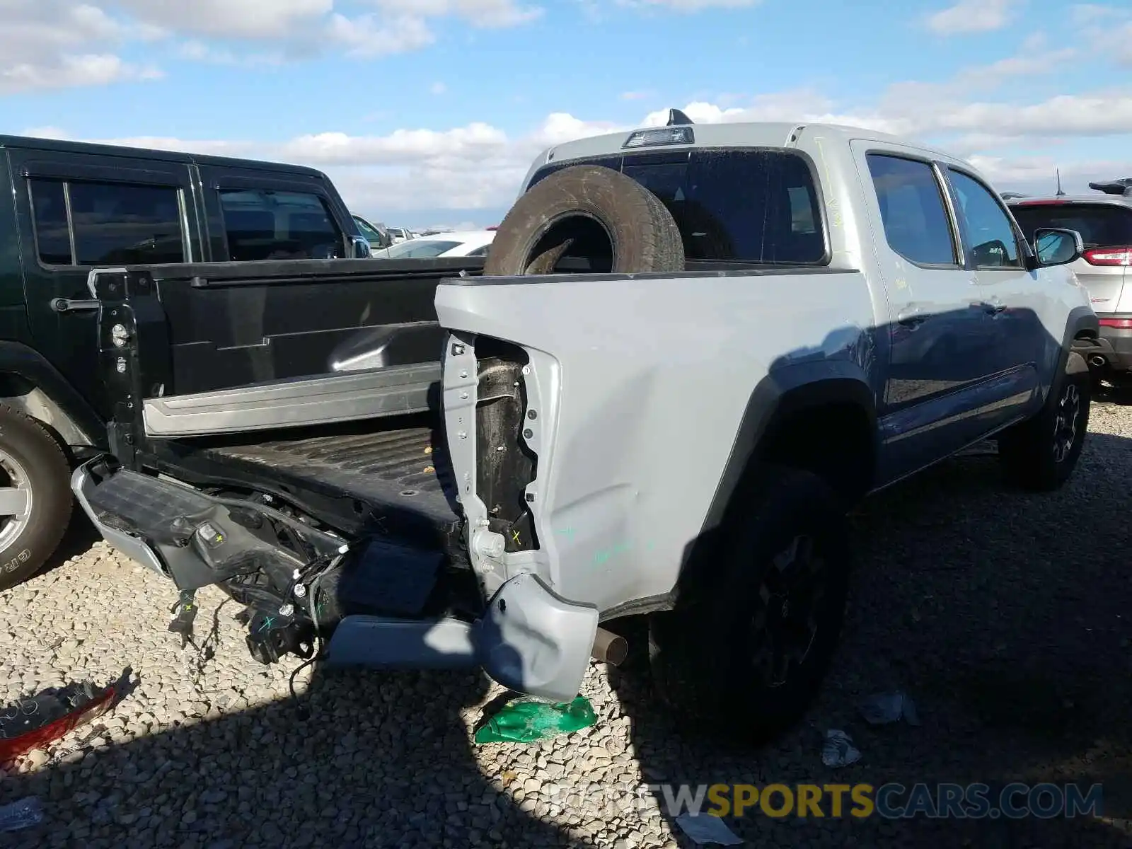 4 Photograph of a damaged car 3TMCZ5AN3KM204978 TOYOTA TACOMA 2019