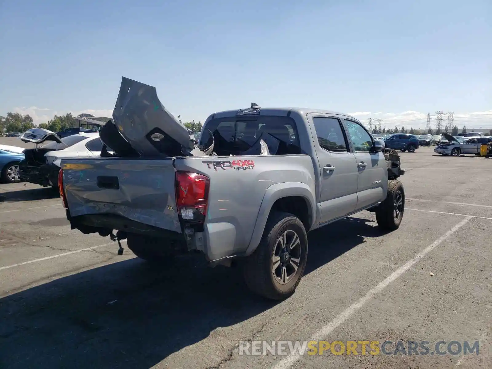 4 Photograph of a damaged car 3TMCZ5AN4KM215729 TOYOTA TACOMA 2019