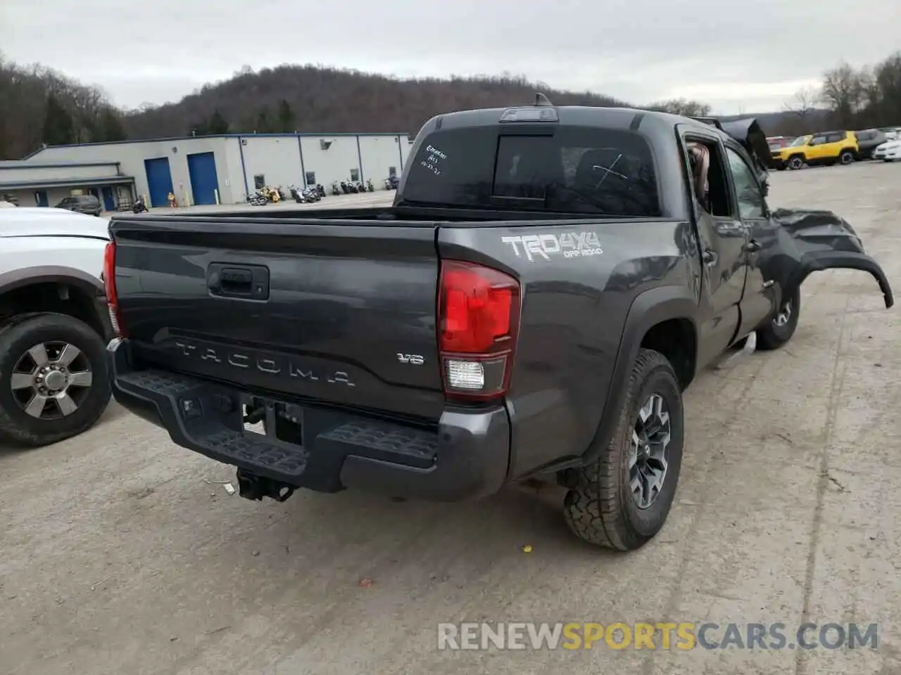 4 Photograph of a damaged car 3TMCZ5AN4KM234409 TOYOTA TACOMA 2019