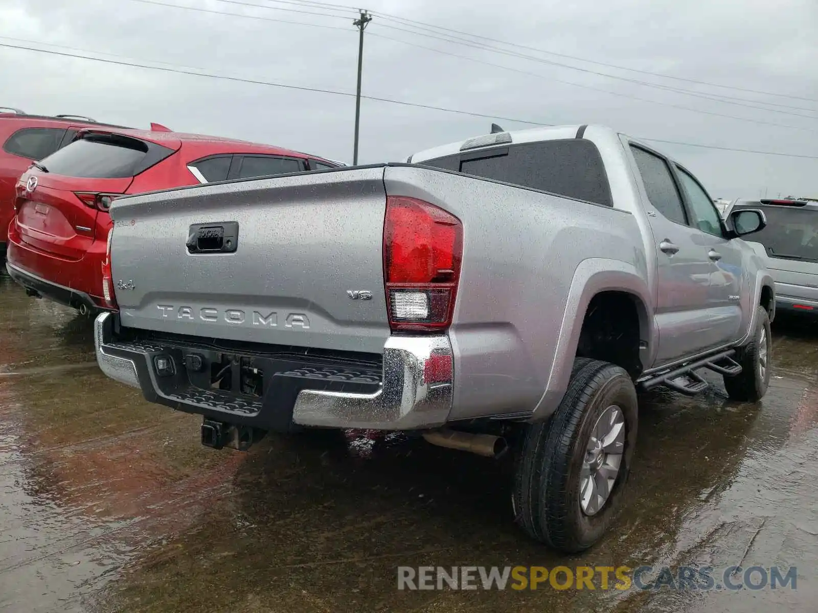 4 Photograph of a damaged car 3TMCZ5AN4KM261383 TOYOTA TACOMA 2019