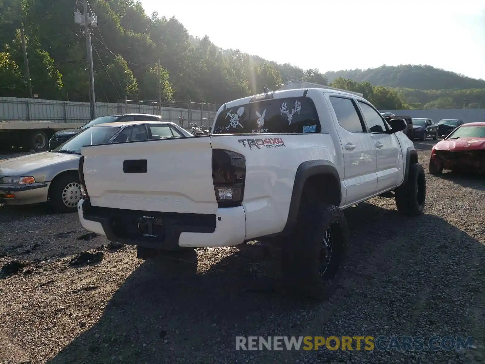 4 Photograph of a damaged car 3TMCZ5AN5KM203265 TOYOTA TACOMA 2019