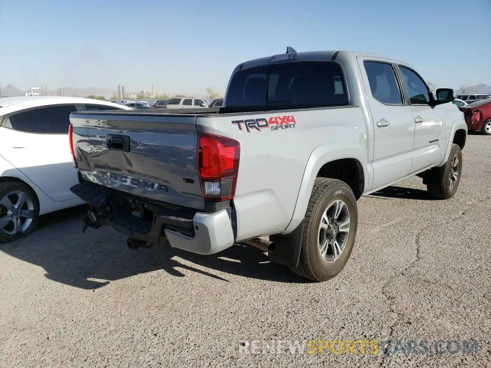 4 Photograph of a damaged car 3TMCZ5AN5KM233379 TOYOTA TACOMA 2019