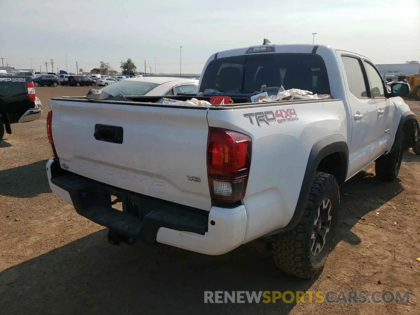 4 Photograph of a damaged car 3TMCZ5AN6KM215604 TOYOTA TACOMA 2019